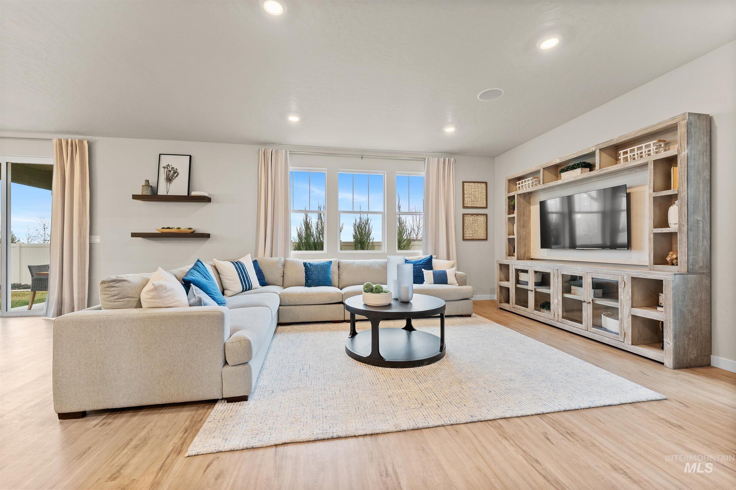 Living room featuring recessed lighting and light wood-style floors