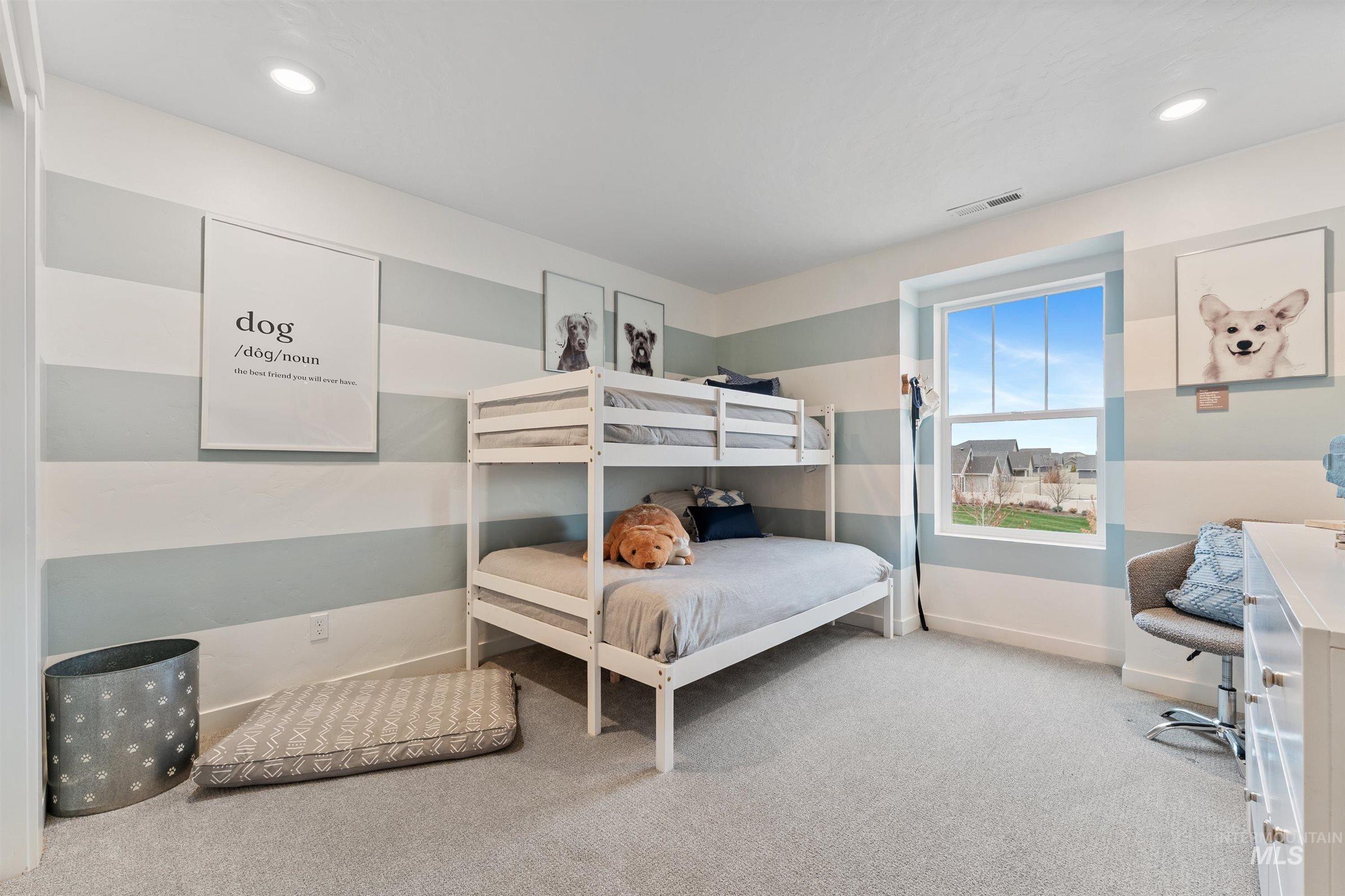 Bedroom featuring light carpet and recessed lighting