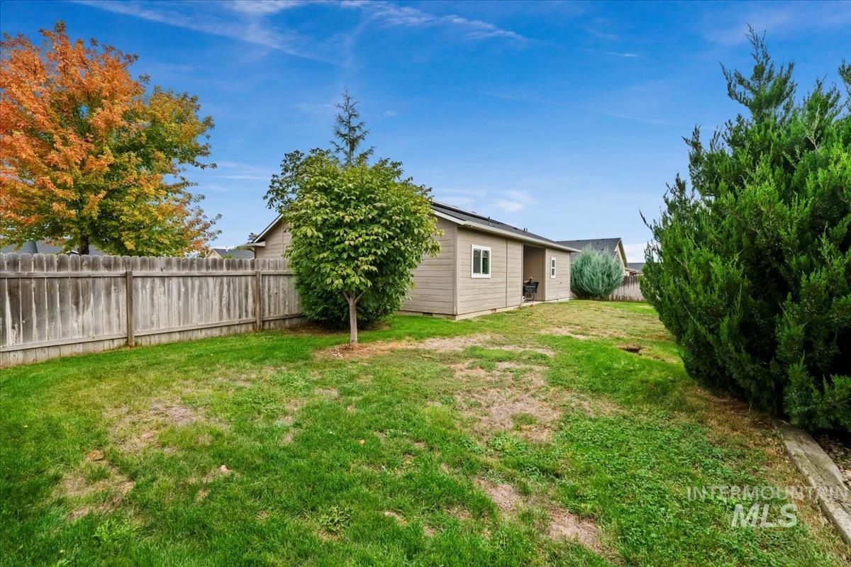 View of fenced backyard