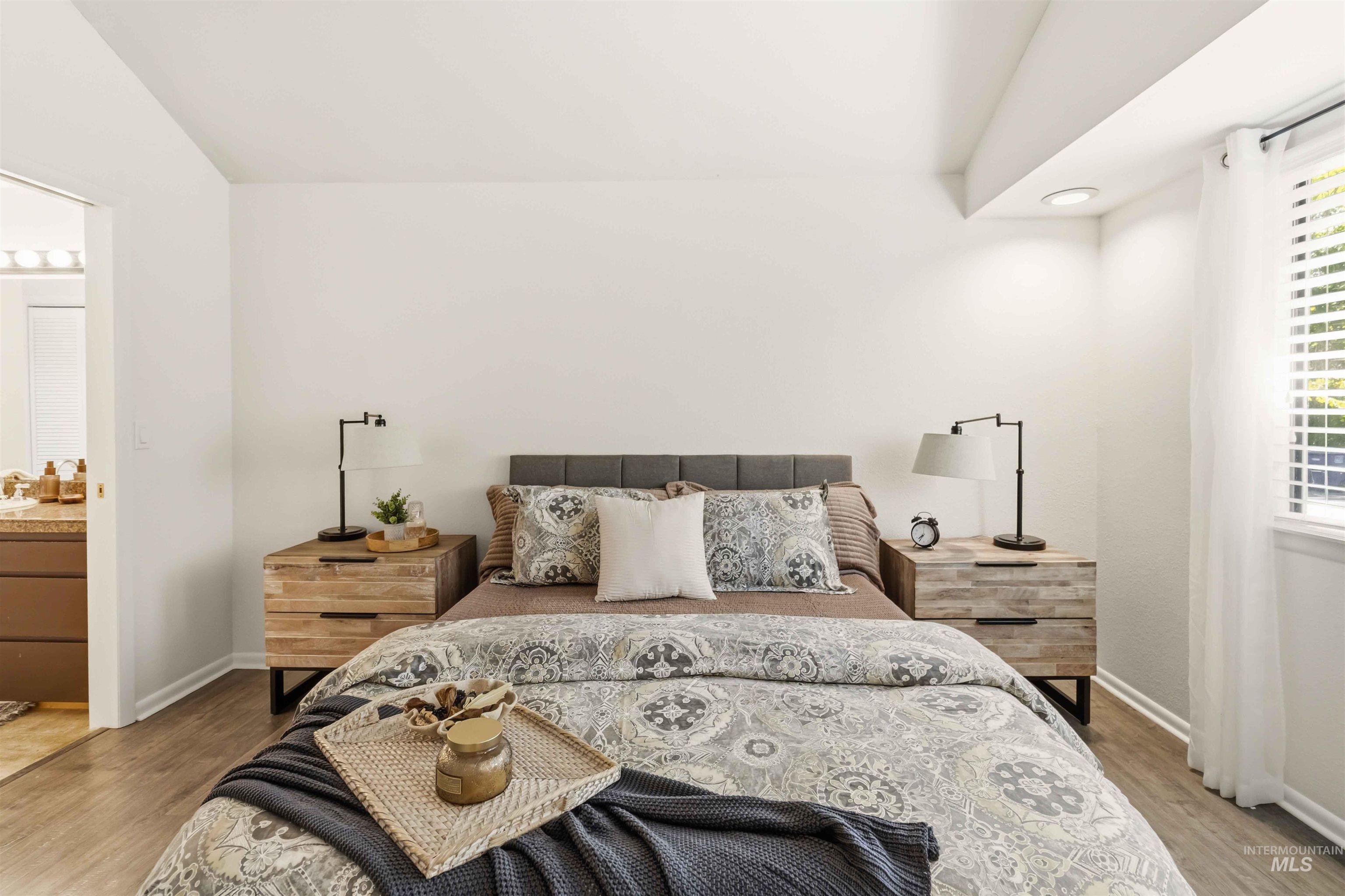 Bedroom featuring wood-finish flooring and light-toned walls