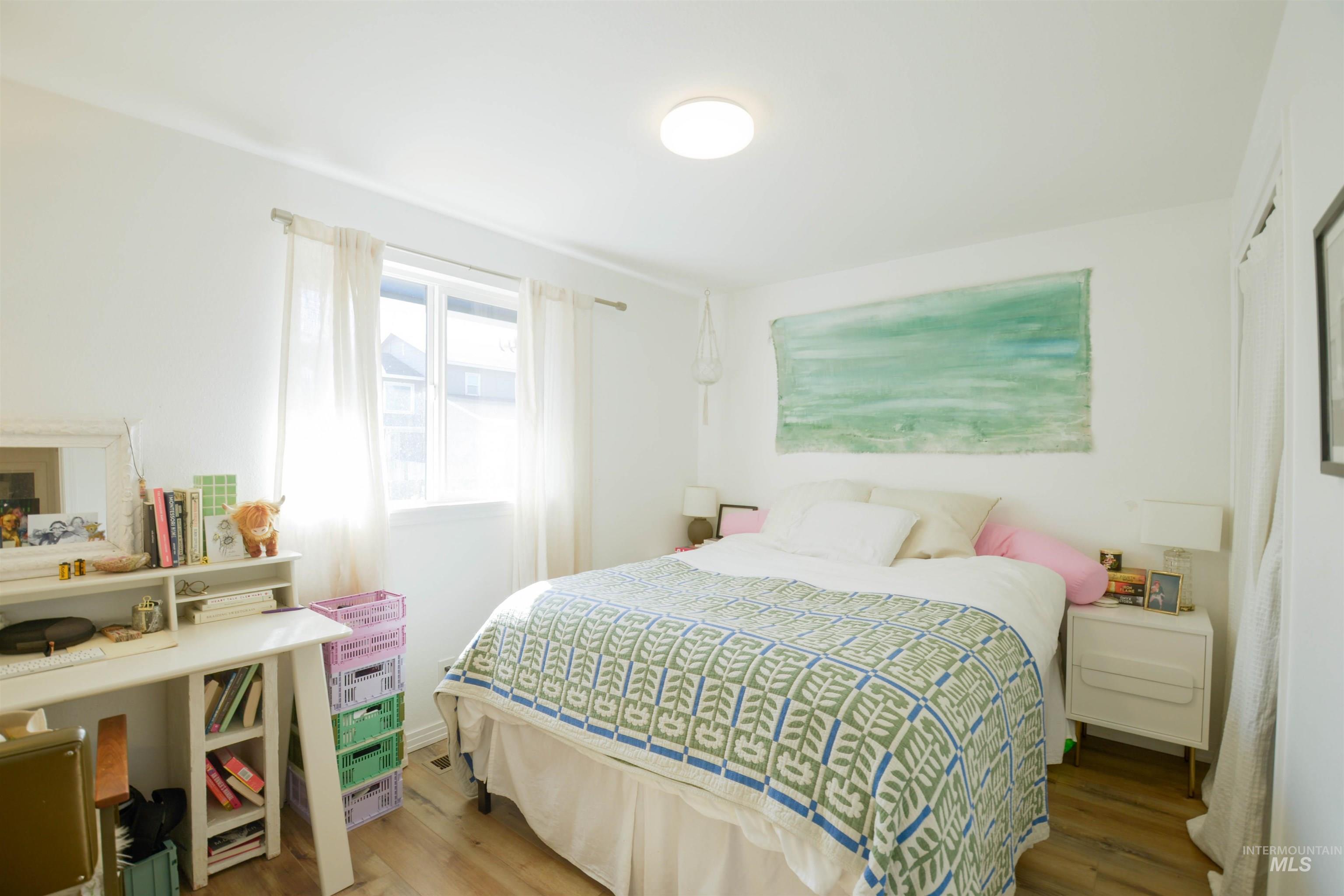 Bedroom with wood finished floors