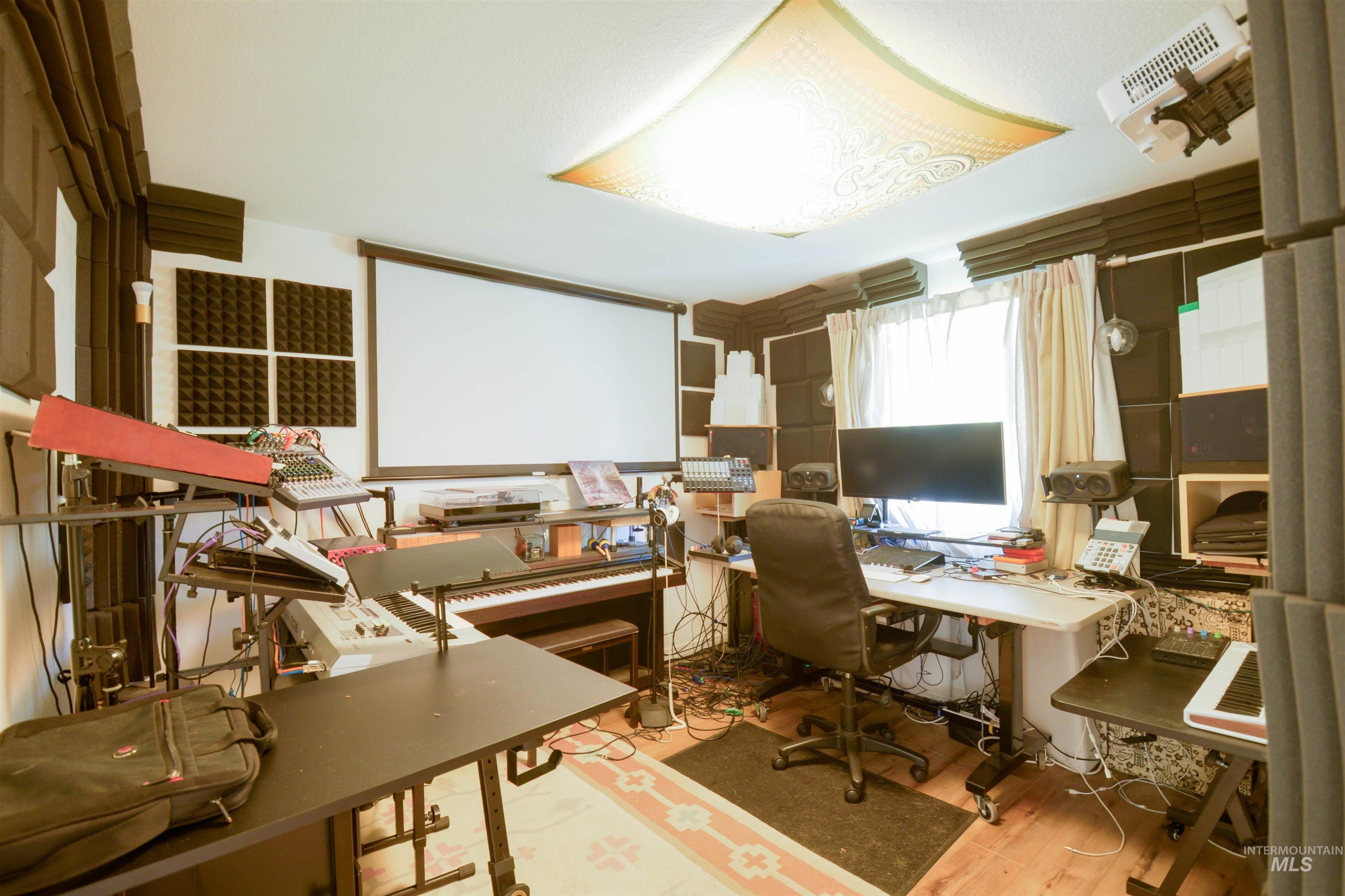 Office space with light wood-style floors