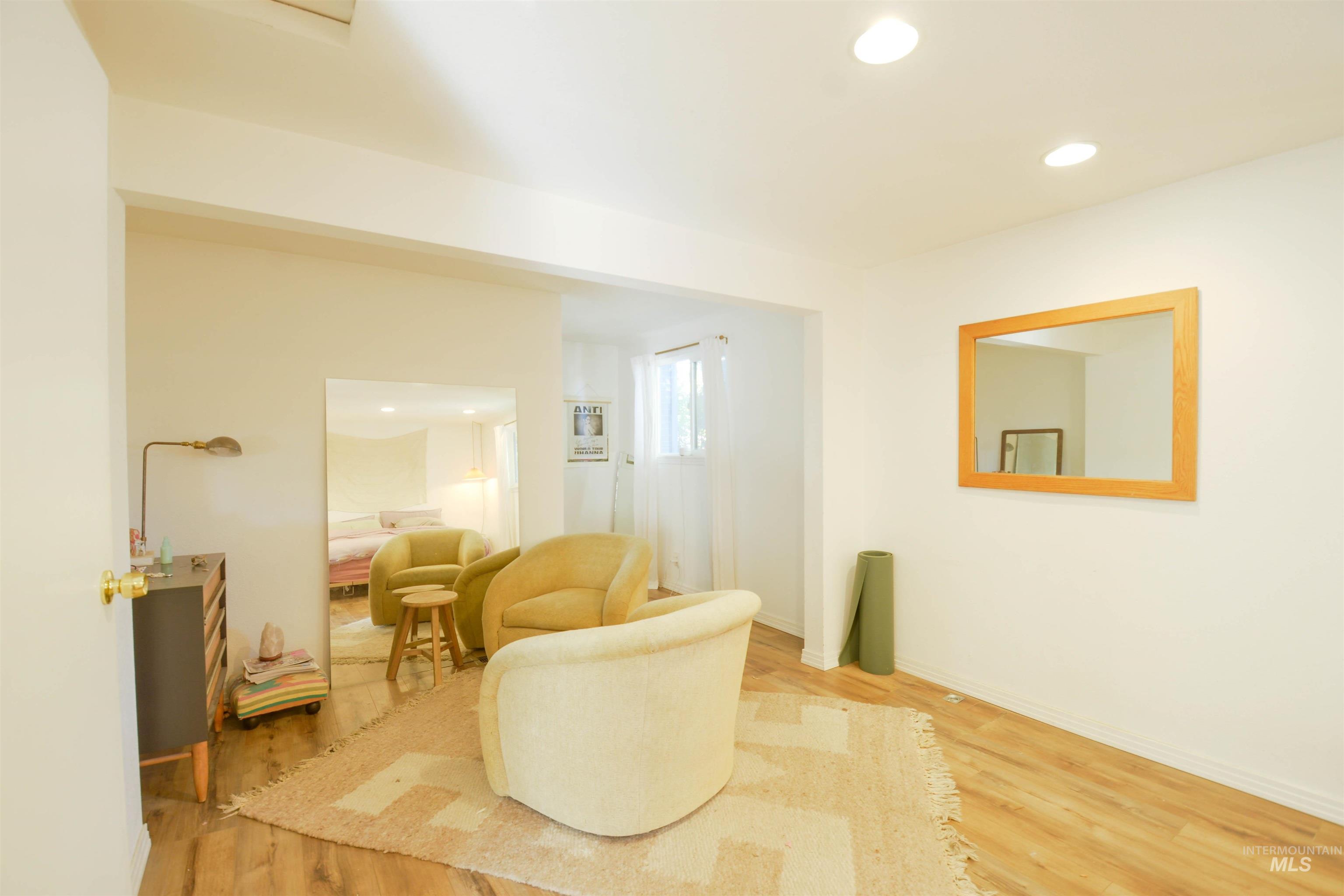 Living area featuring recessed lighting and light wood-style flooring