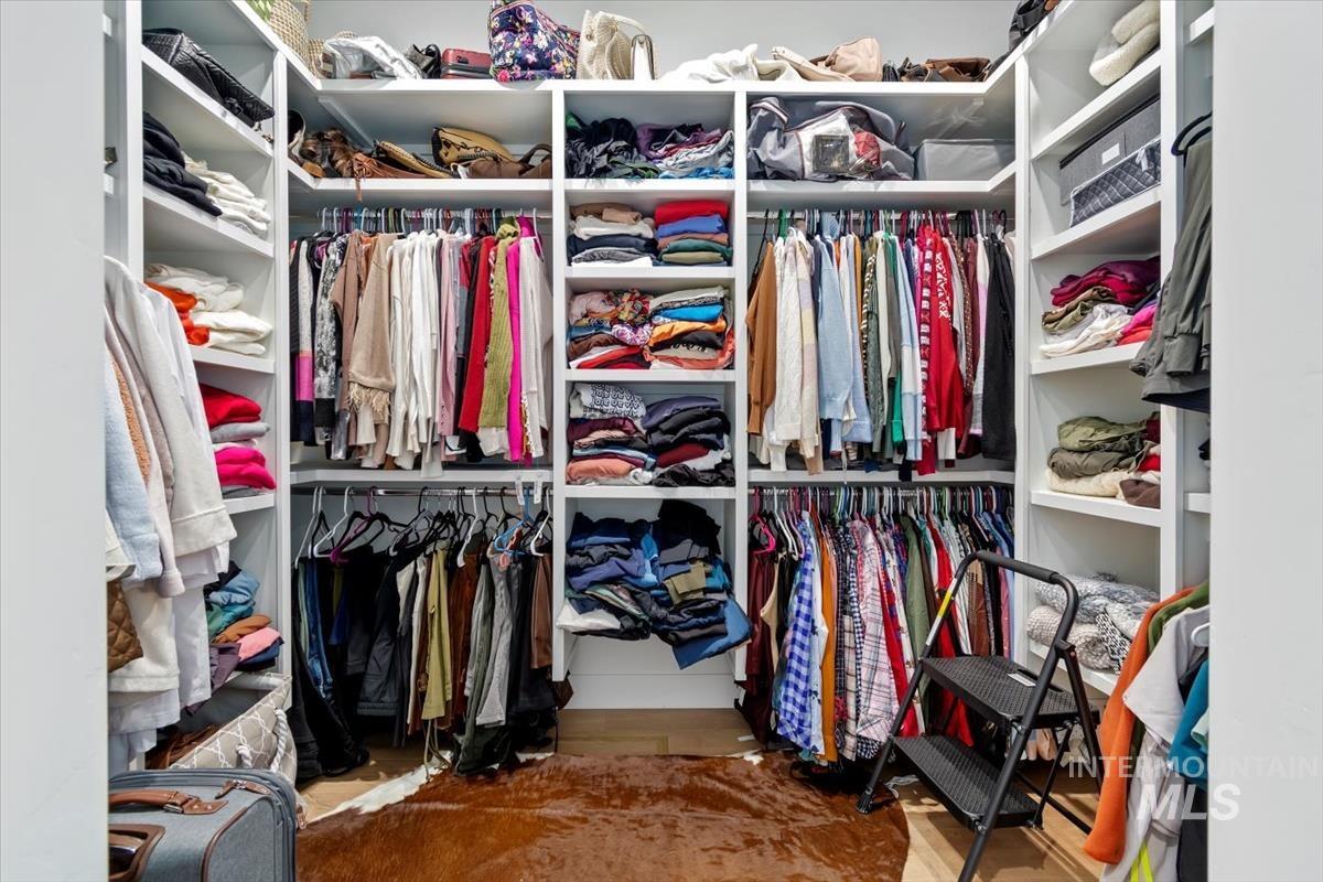Spacious closet with wood finished floors