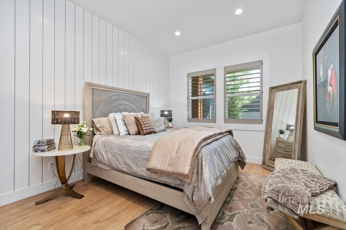 Bedroom with light wood-style flooring and recessed lighting