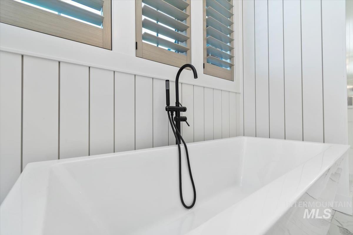 Bathroom view of a soaking tub and a sink