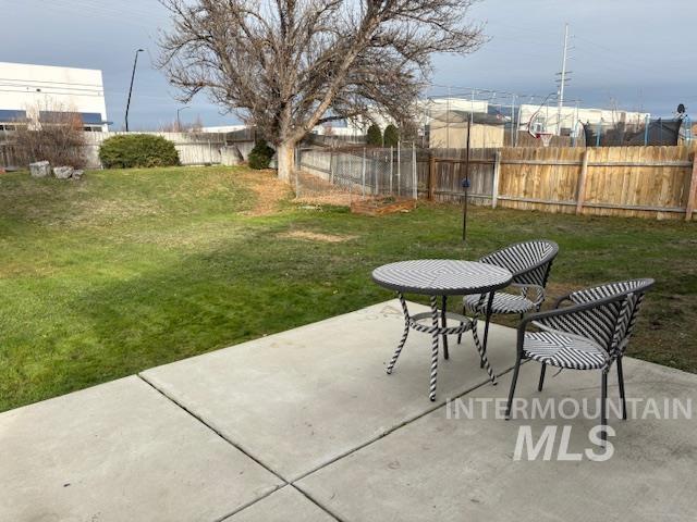 Fenced backyard featuring a patio area