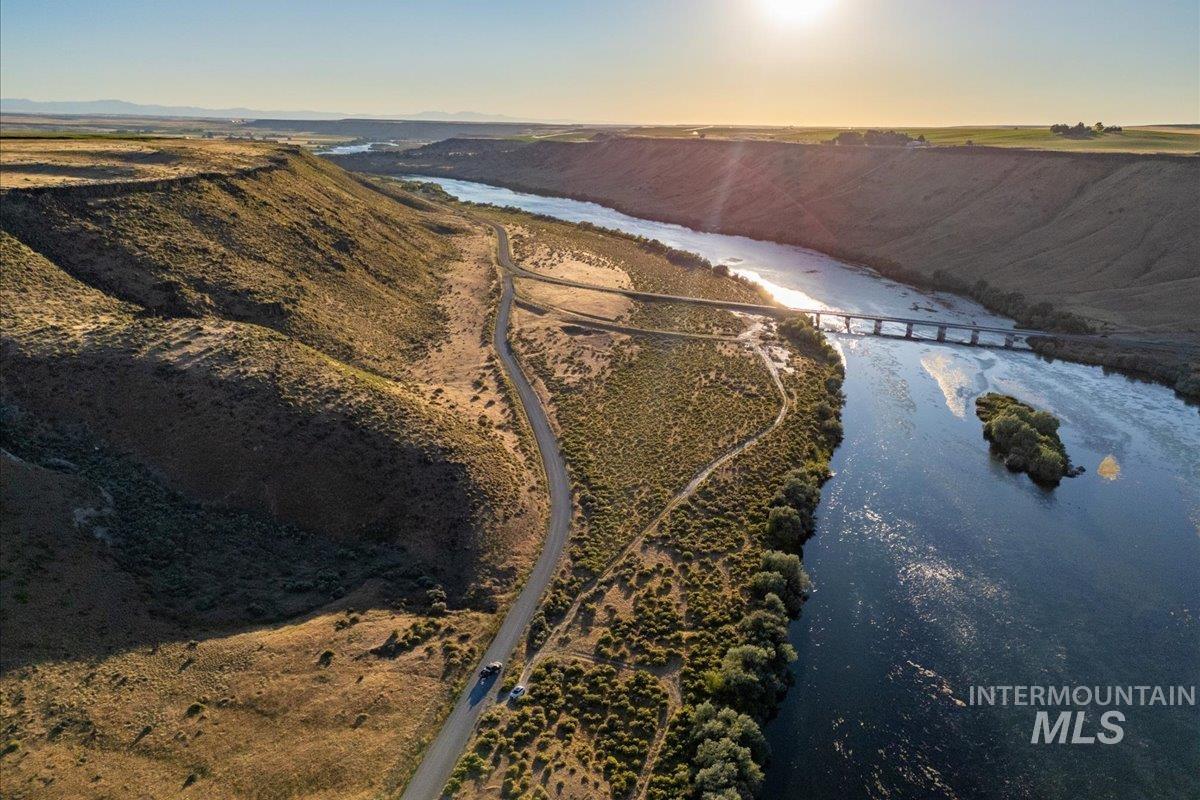 Aerial view of property's location with a large body of water