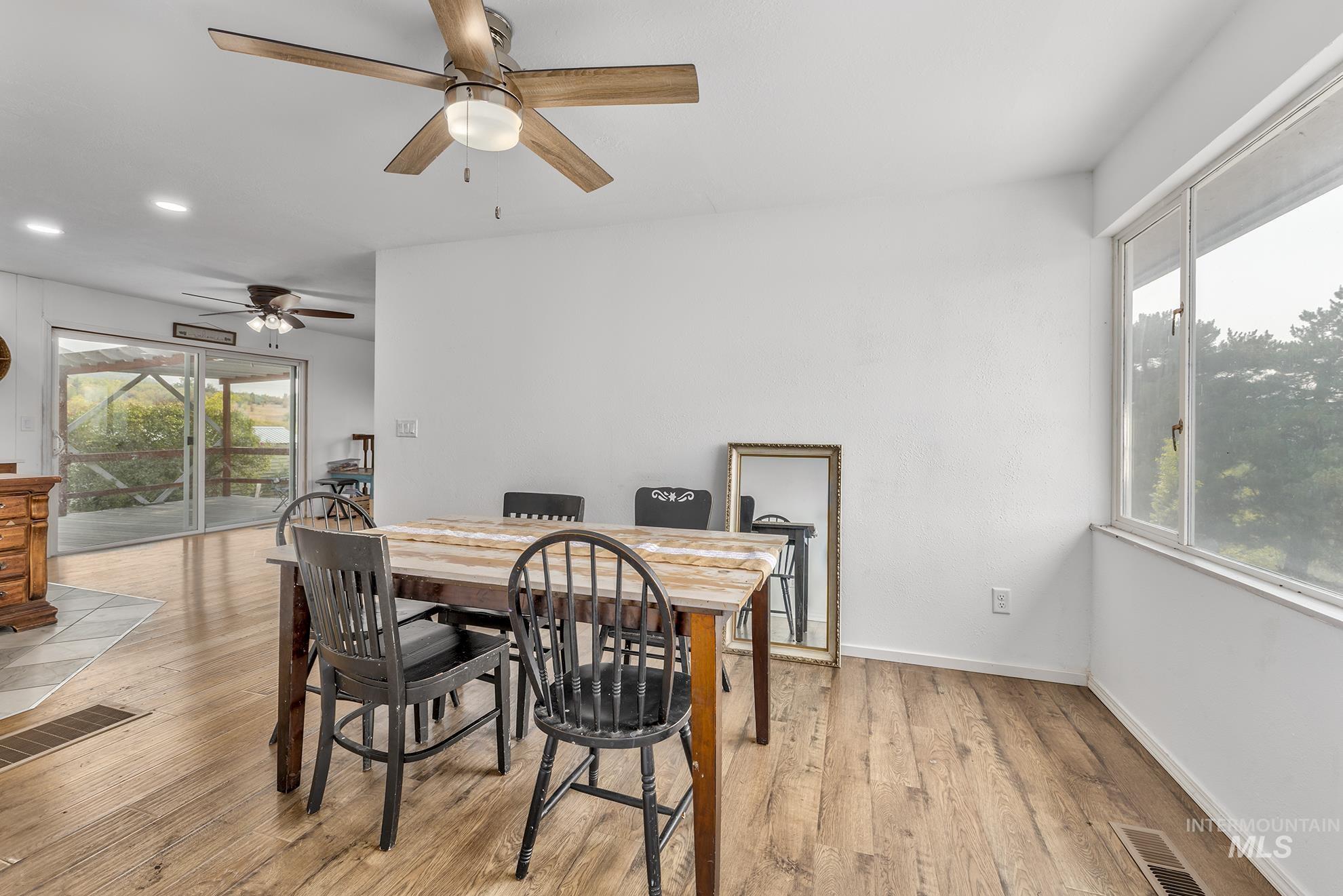 Dining room featuring healthy amount of natural light and light wood-style flooring