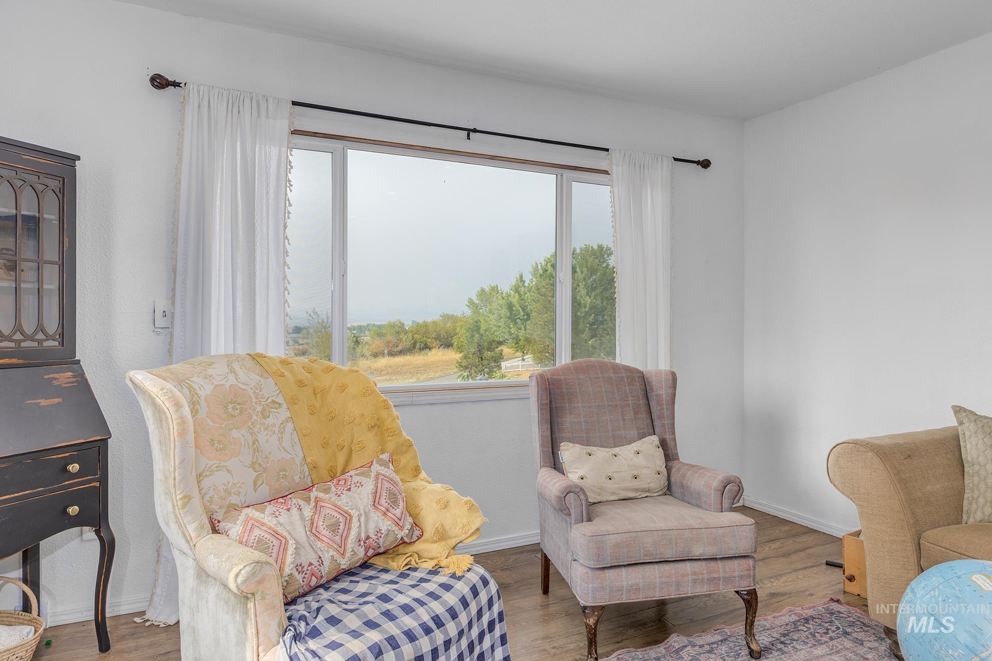 Living area with wood finished floors