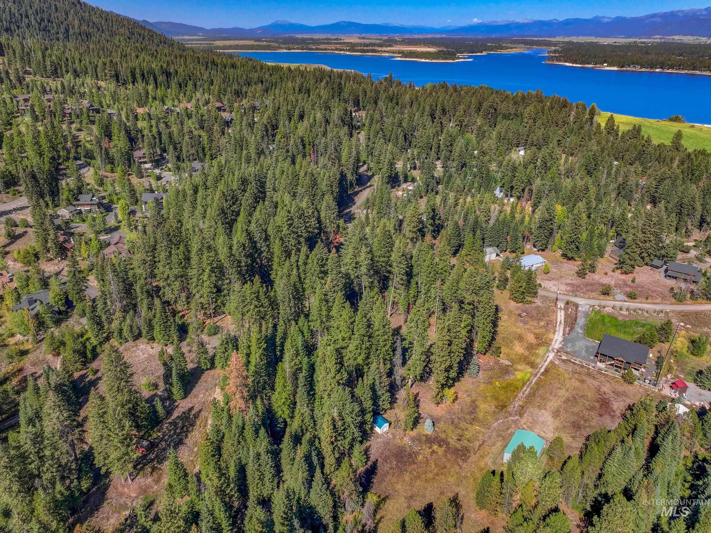 Aerial view of property's location and a nearby body of water