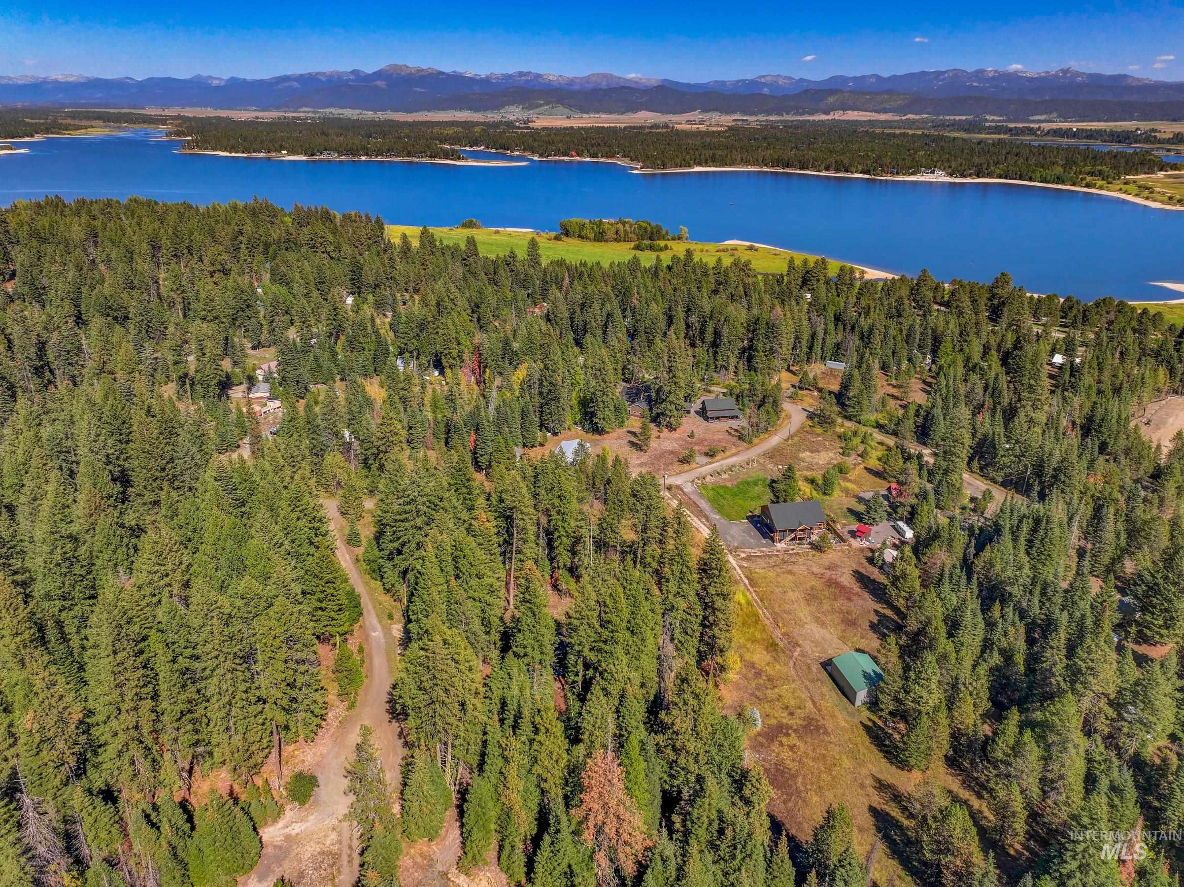 Aerial overview of property's location and a nearby body of water