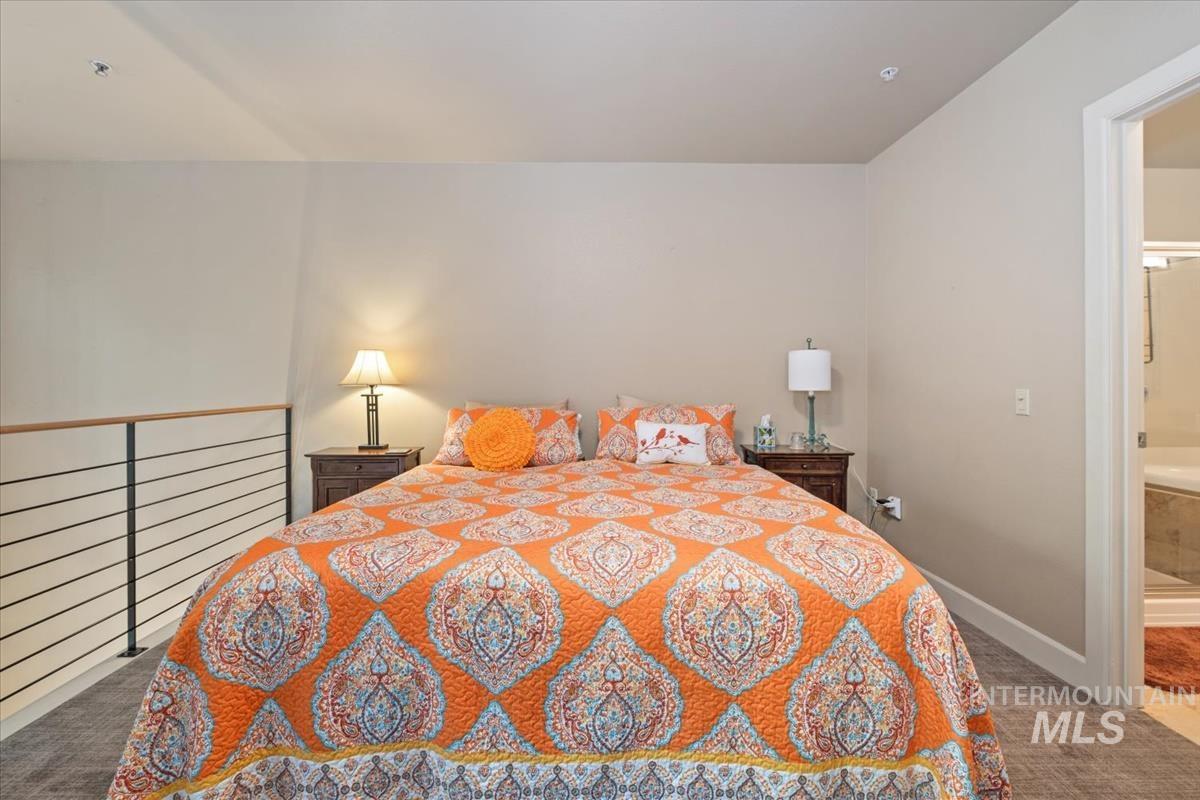 Bedroom with carpet and baseboards