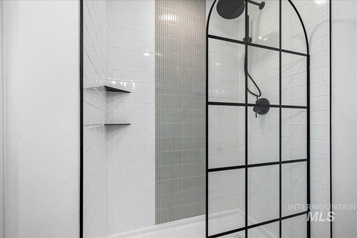 Bathroom featuring walk in shower