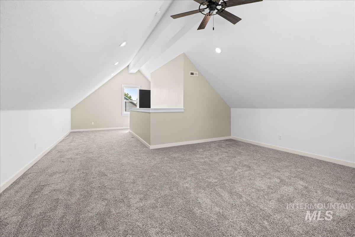 Bonus room featuring carpet and ceiling fan