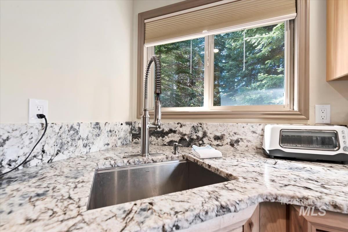 Kitchen view of light stone counters