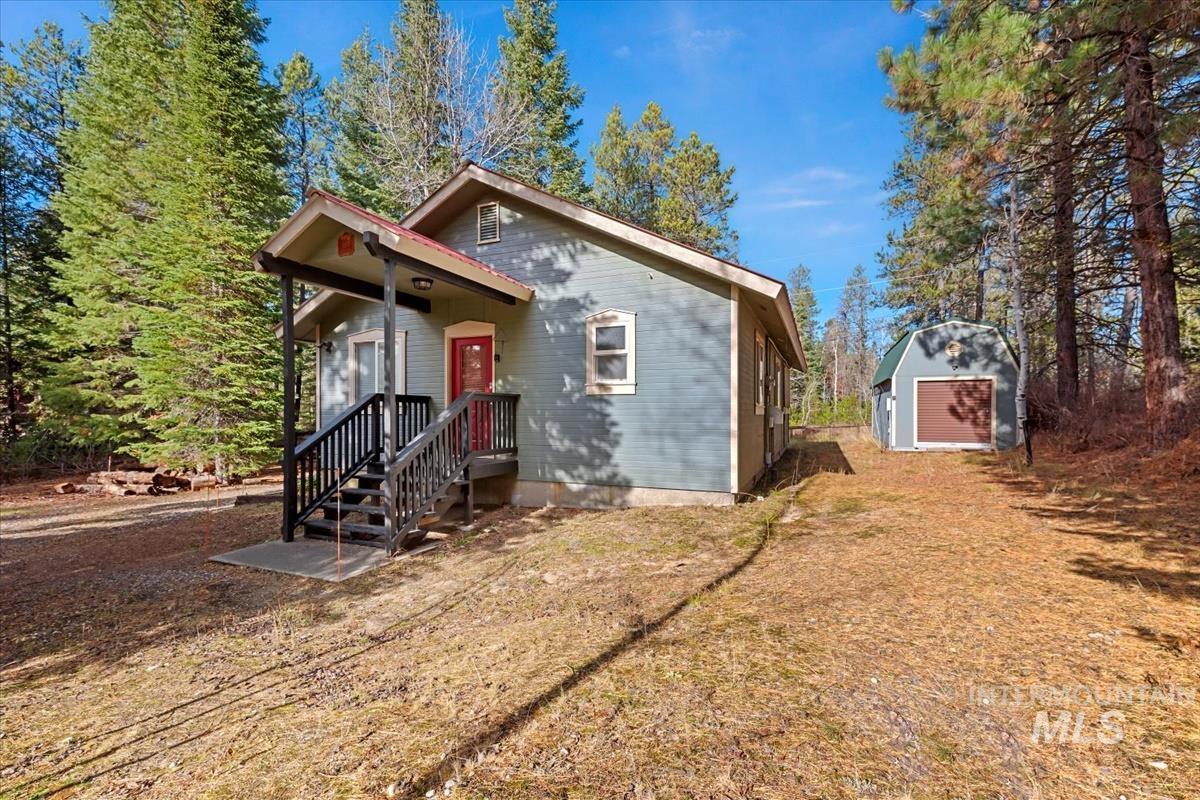 View of front facade featuring a storage shed