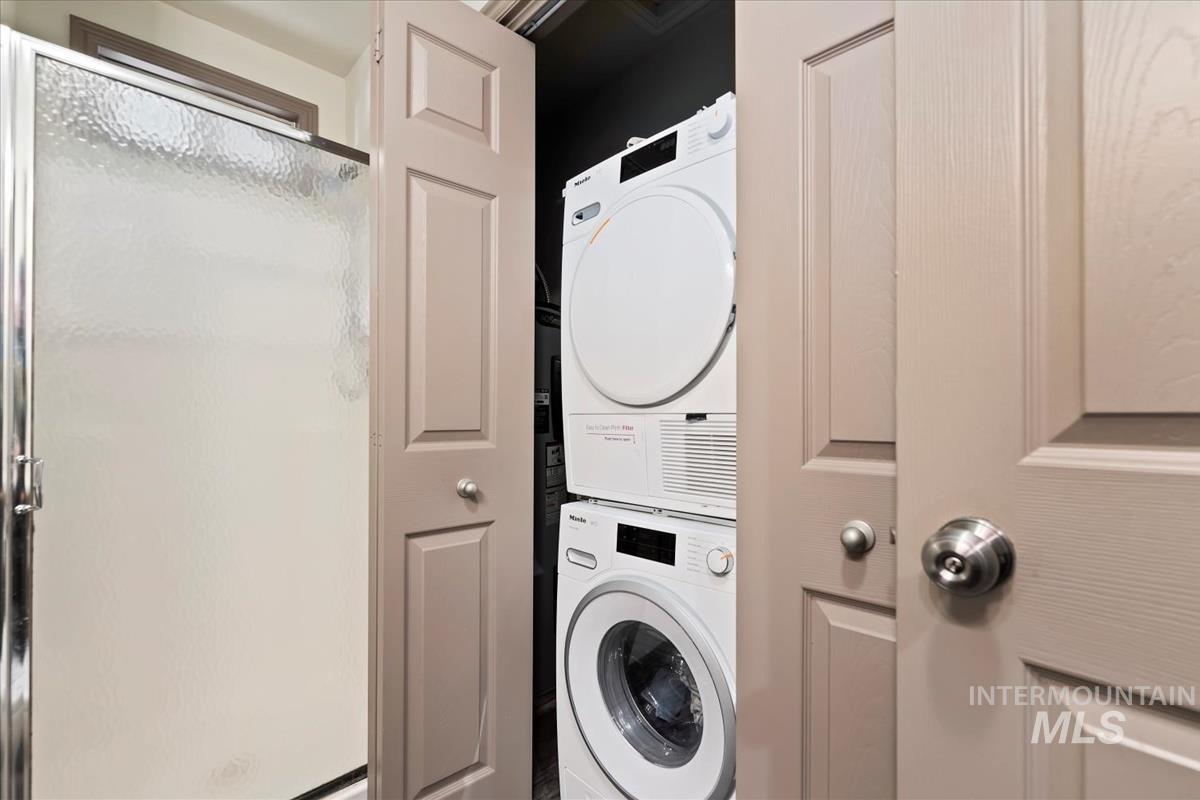 Laundry area with stacked washer / dryer