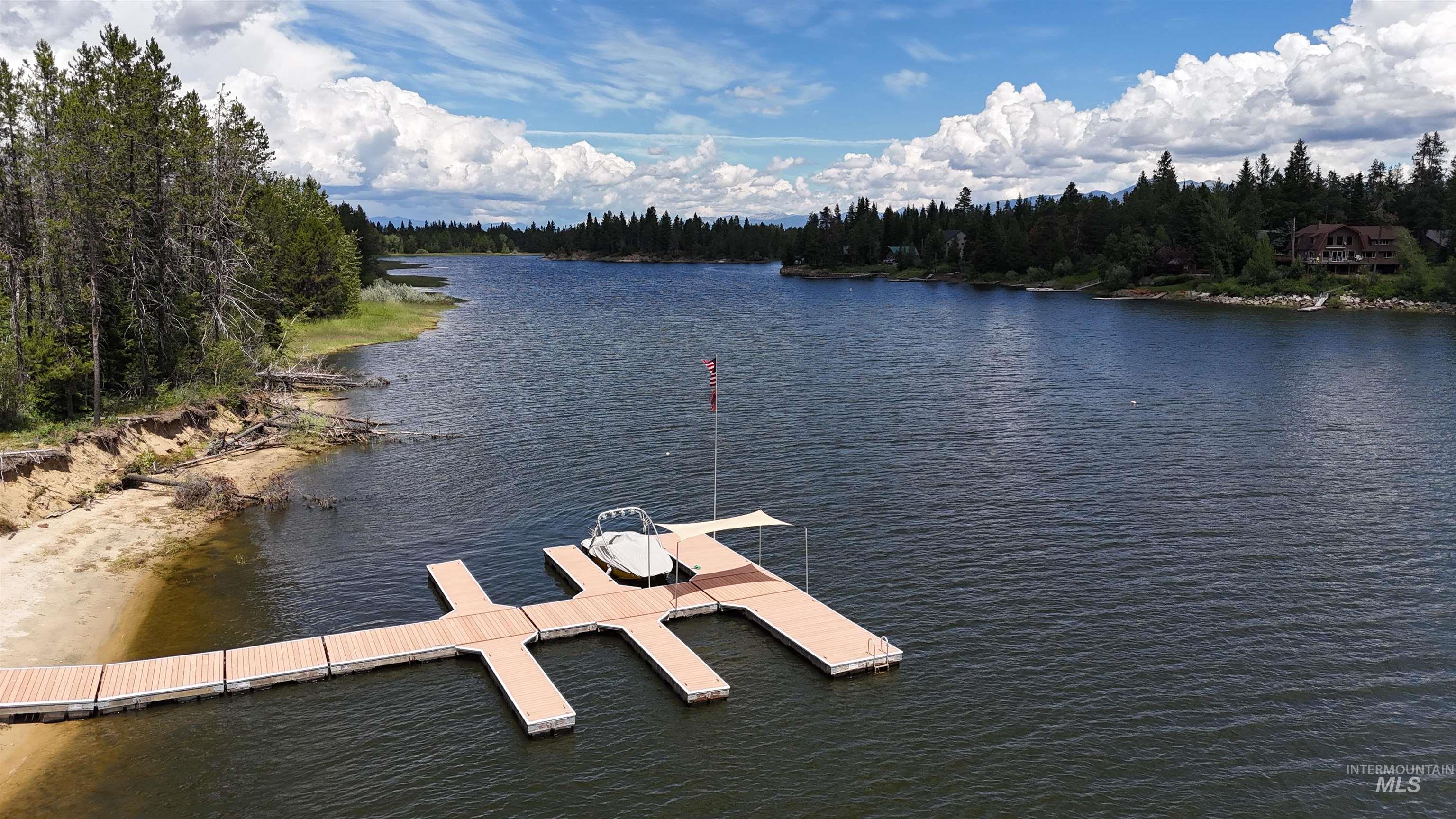 Expansive lakefront property featuring a private dock system with multiple slips