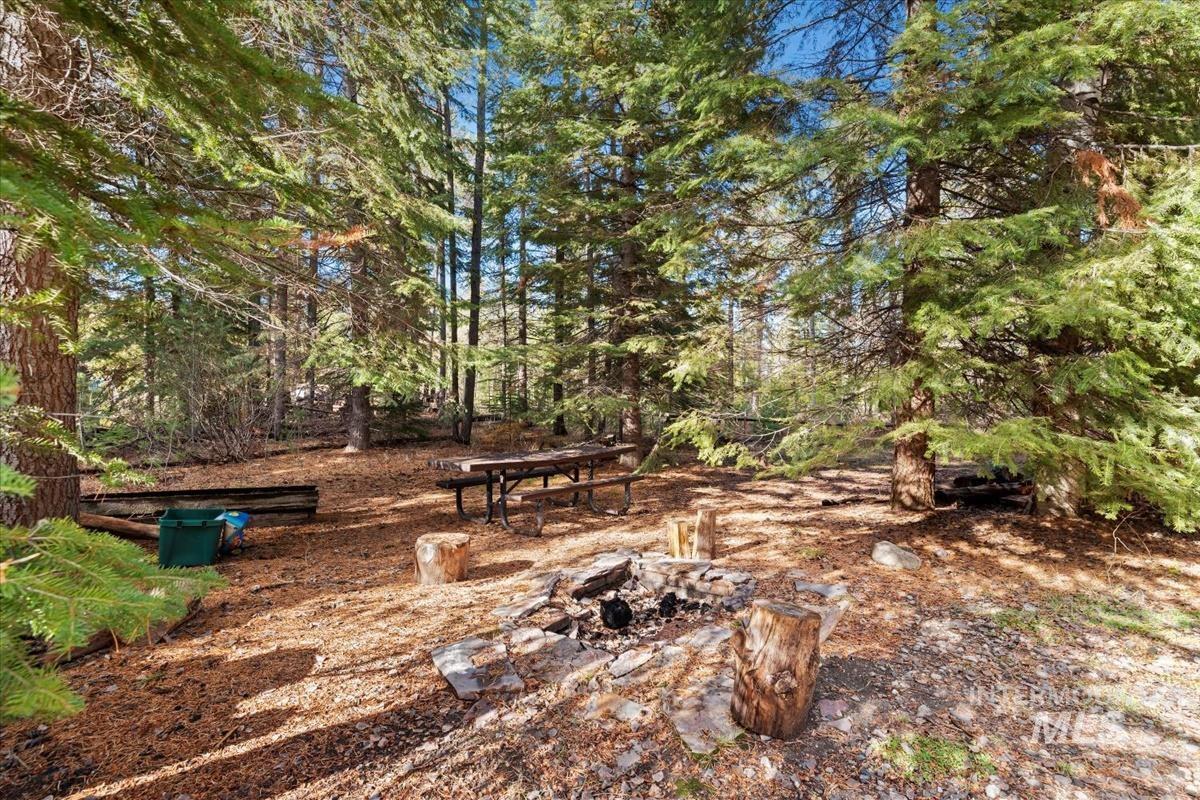 View of yard with an outdoor fire pit
