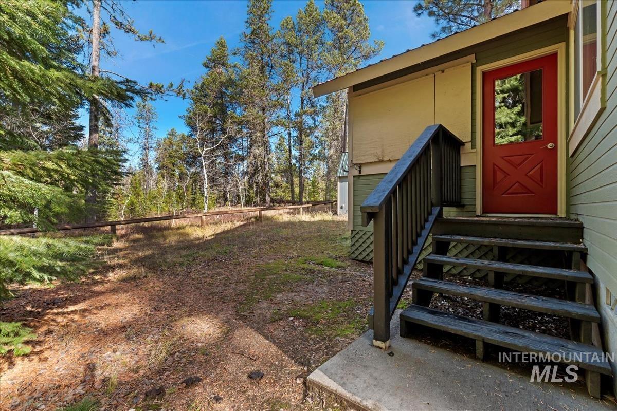 View of yard with entry steps