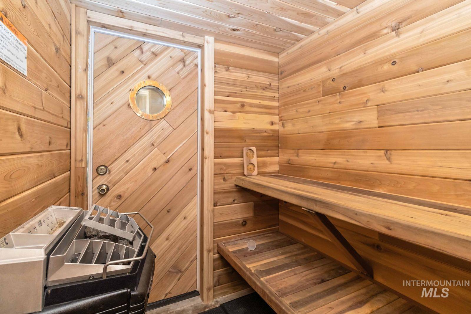 Relaxing sauna with wooden ceiling and wooden walls