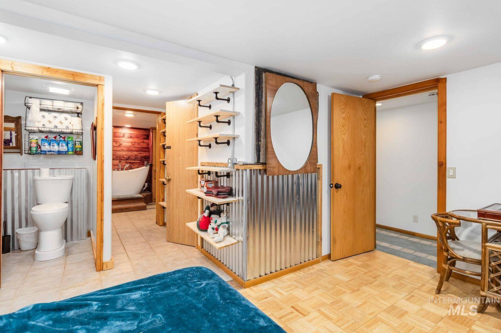 Full bathroom with a freestanding tub and recessed lighting
