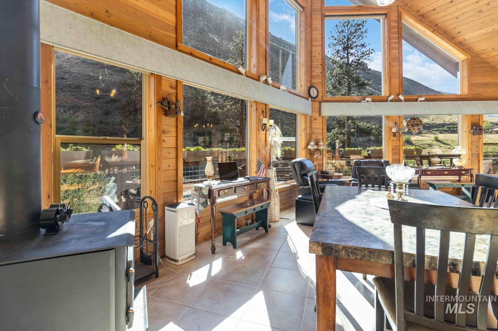 Sunroom with vaulted ceiling and healthy amount of natural light