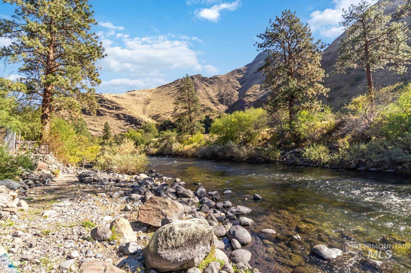 View of mountain backdrop featuring a nearby body of water