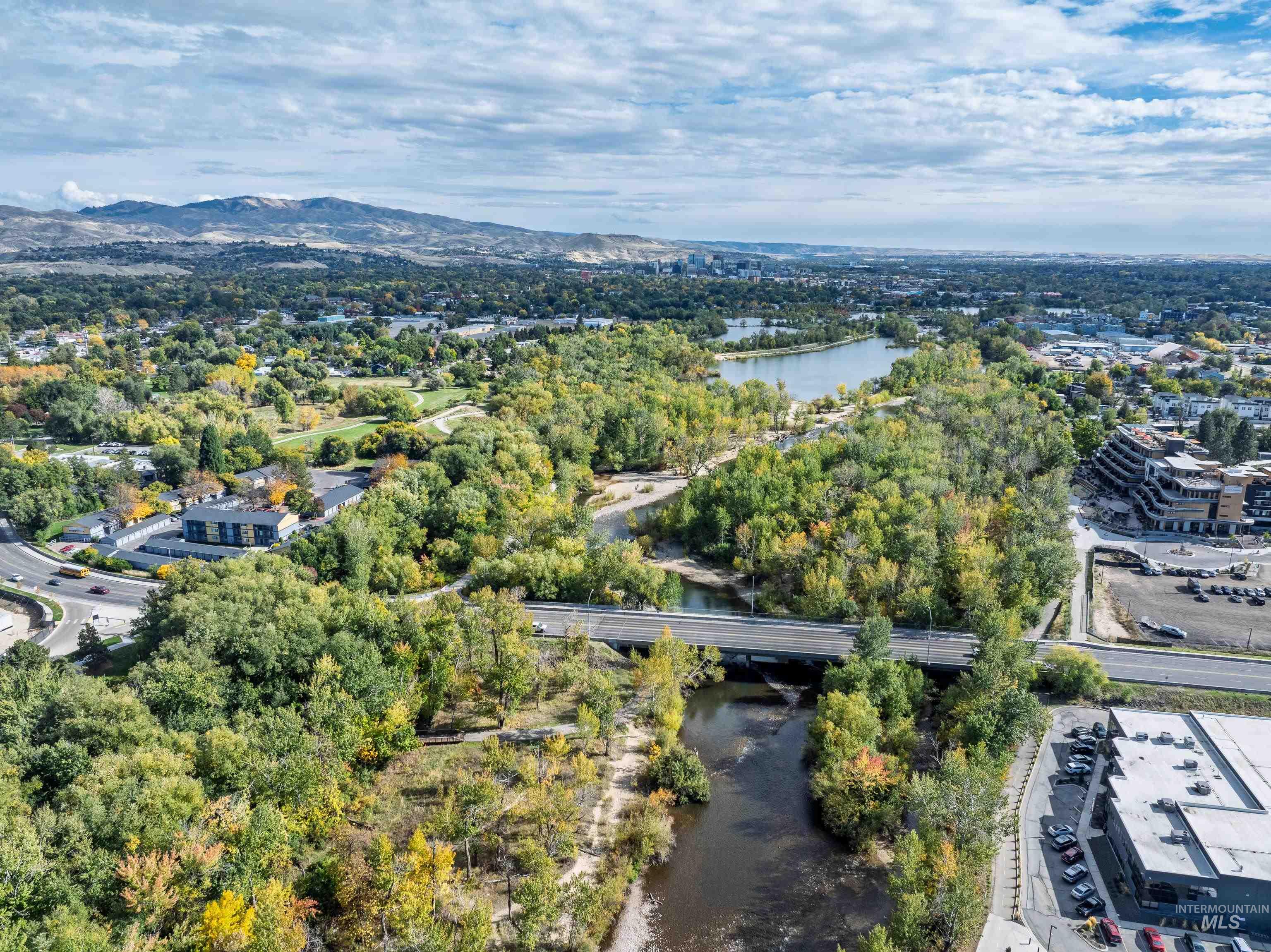 Drone / aerial view of a water and mountain view and a notable bridge