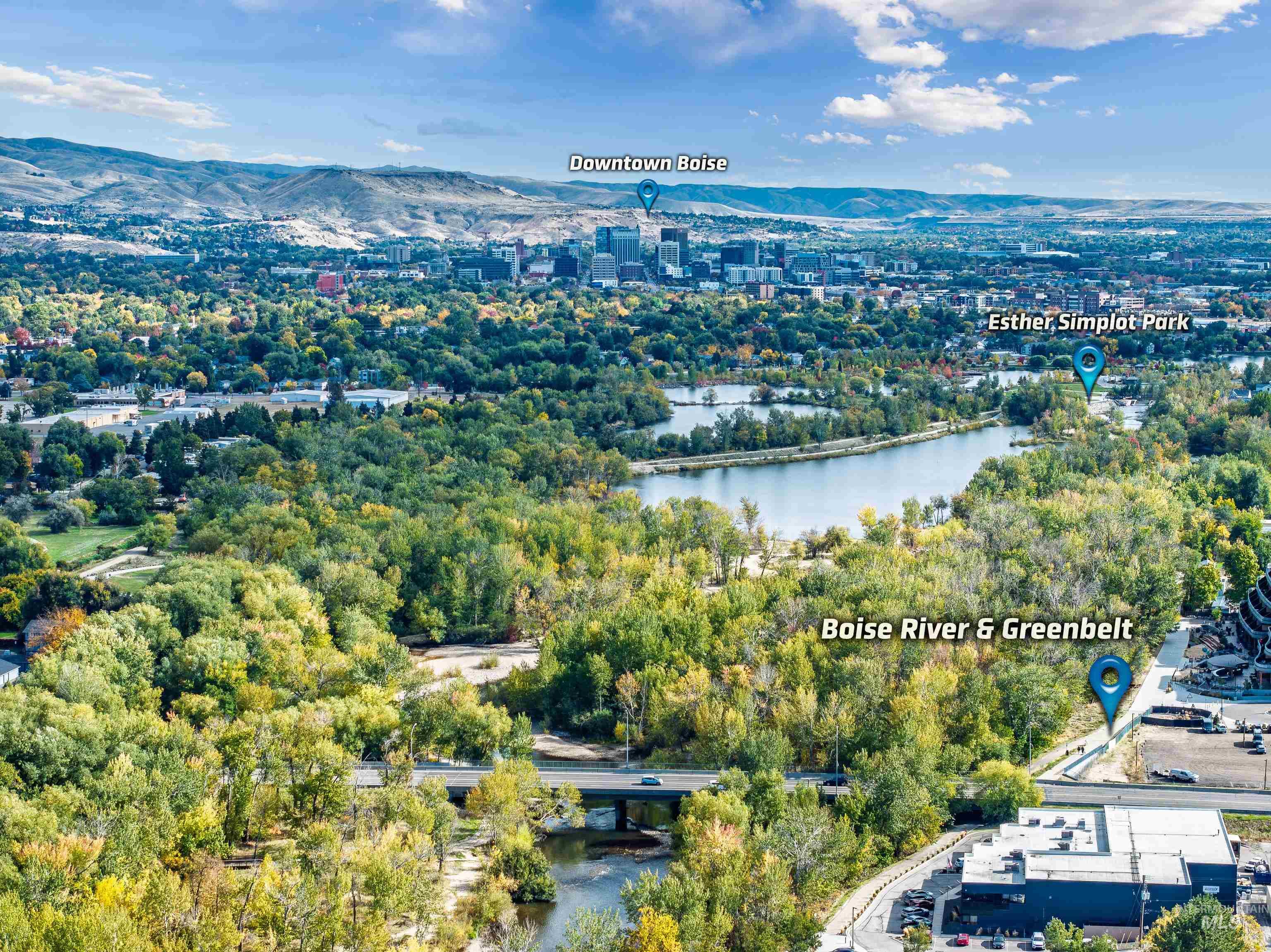 Drone / aerial view of a water and mountain view and a notable bridge
