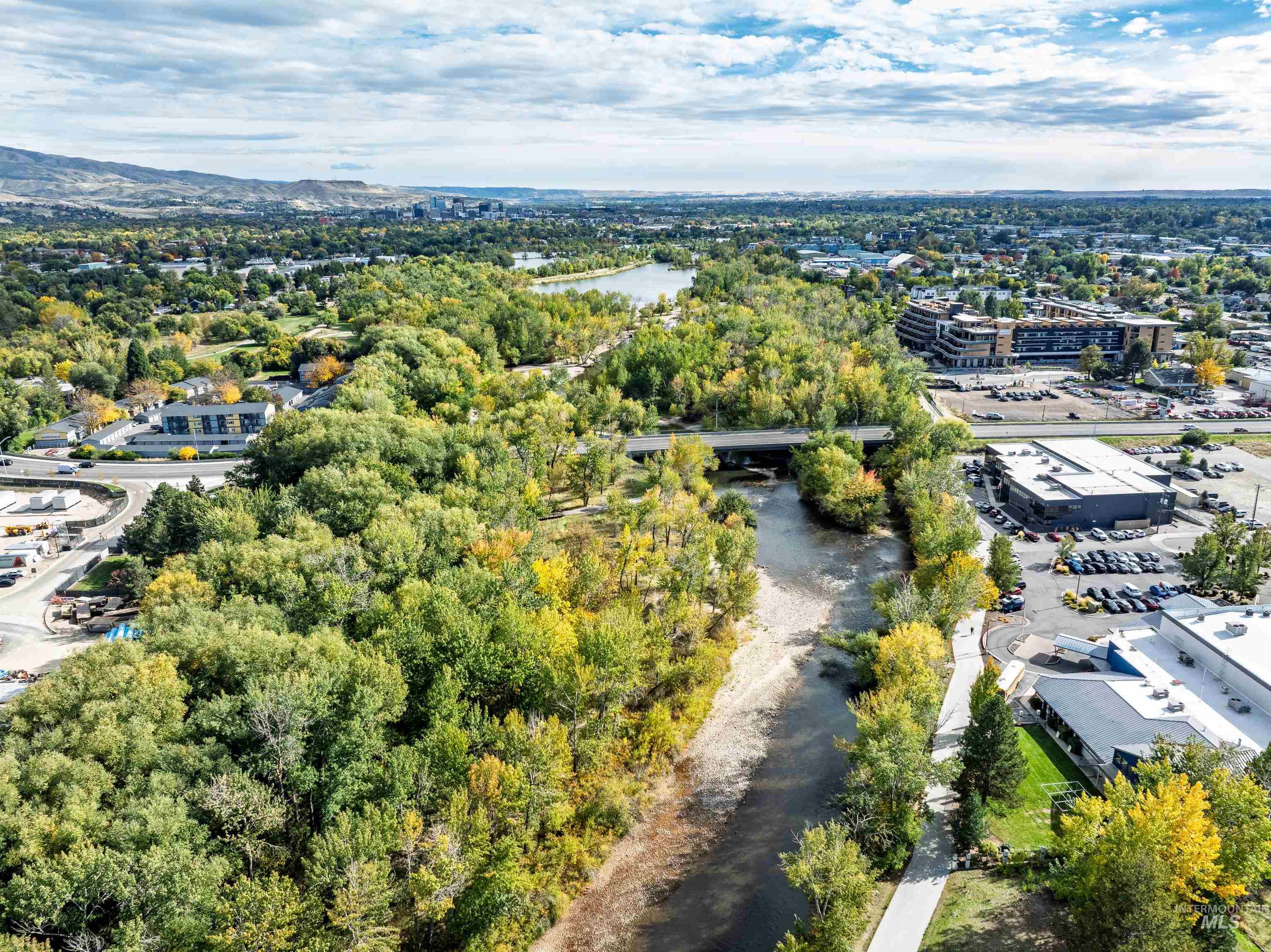 Drone / aerial view of a large body of water and a notable bridge