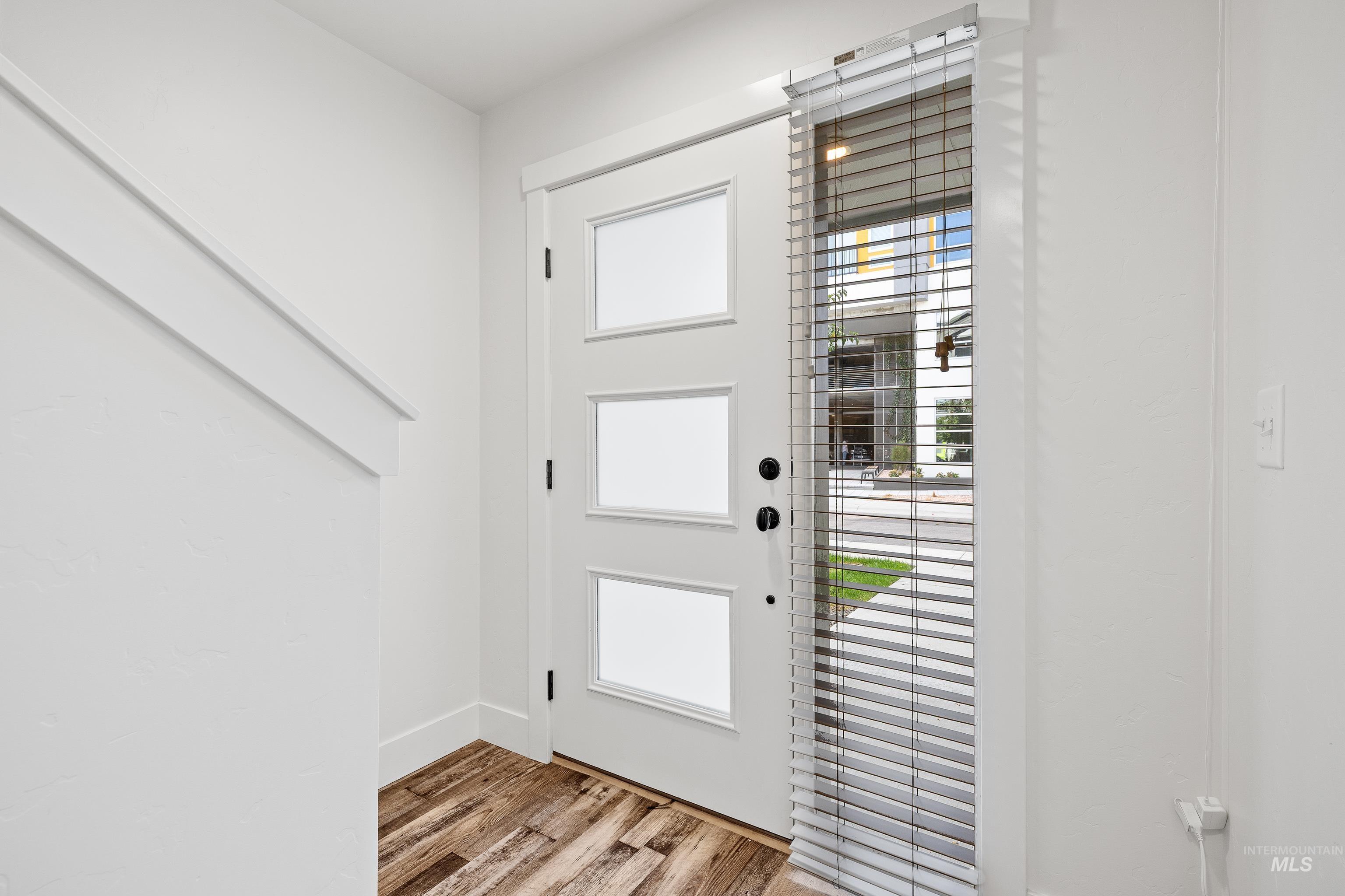 Entrance foyer featuring light wood-style flooring