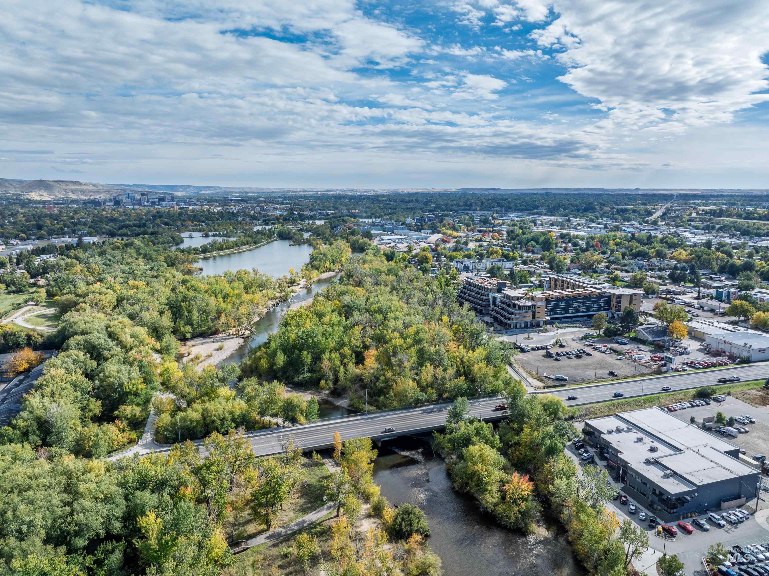 Drone / aerial view of a large body of water and a notable bridge