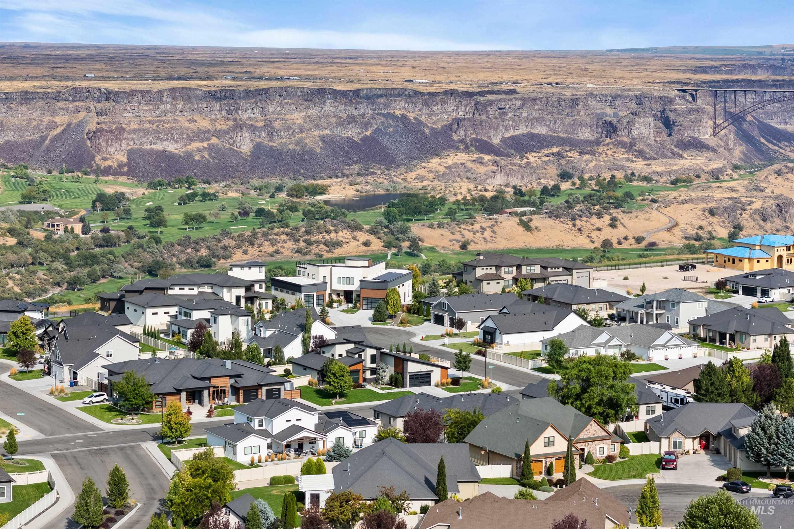 Aerial view of property's location featuring nearby suburban area