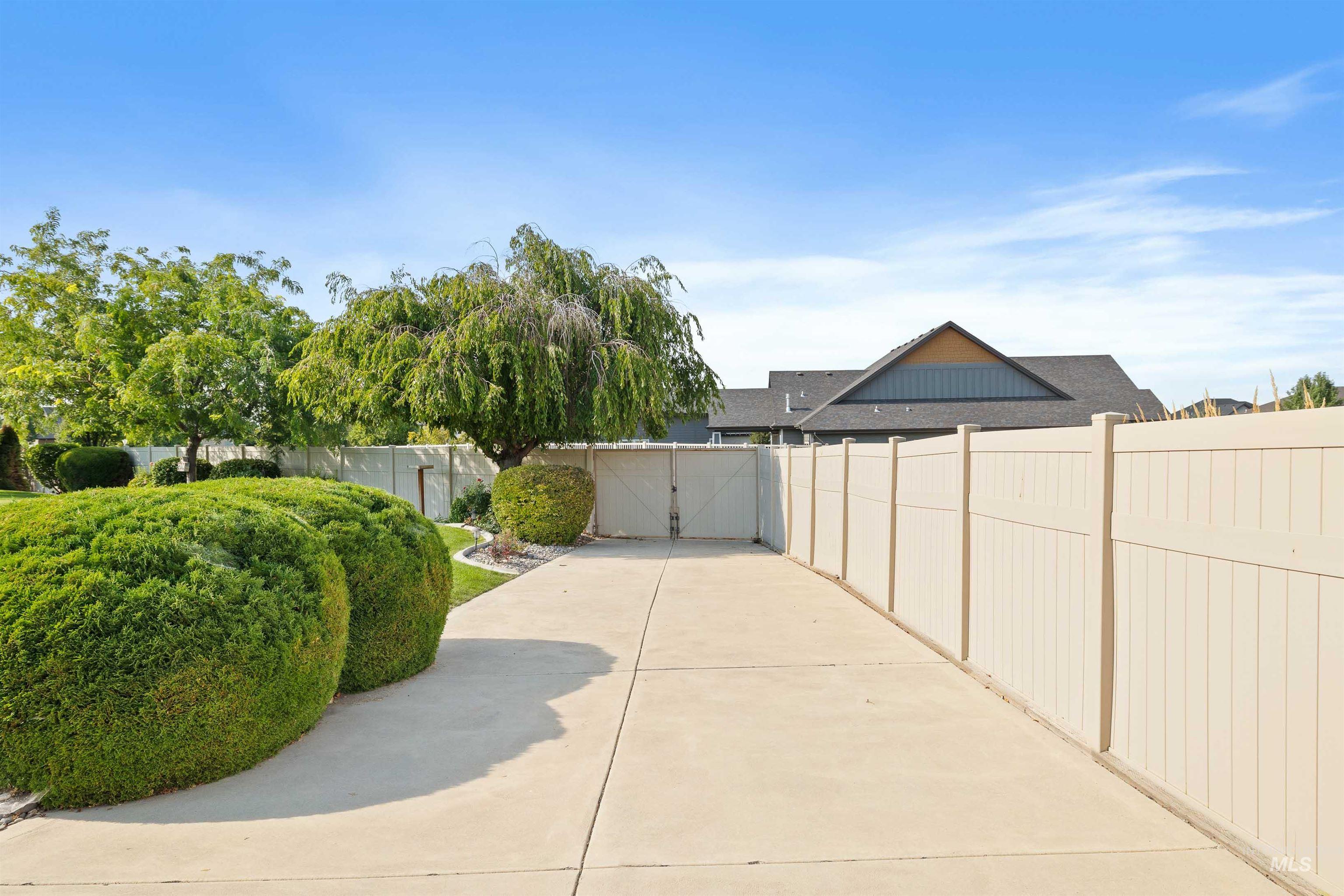 View of patio featuring a gate