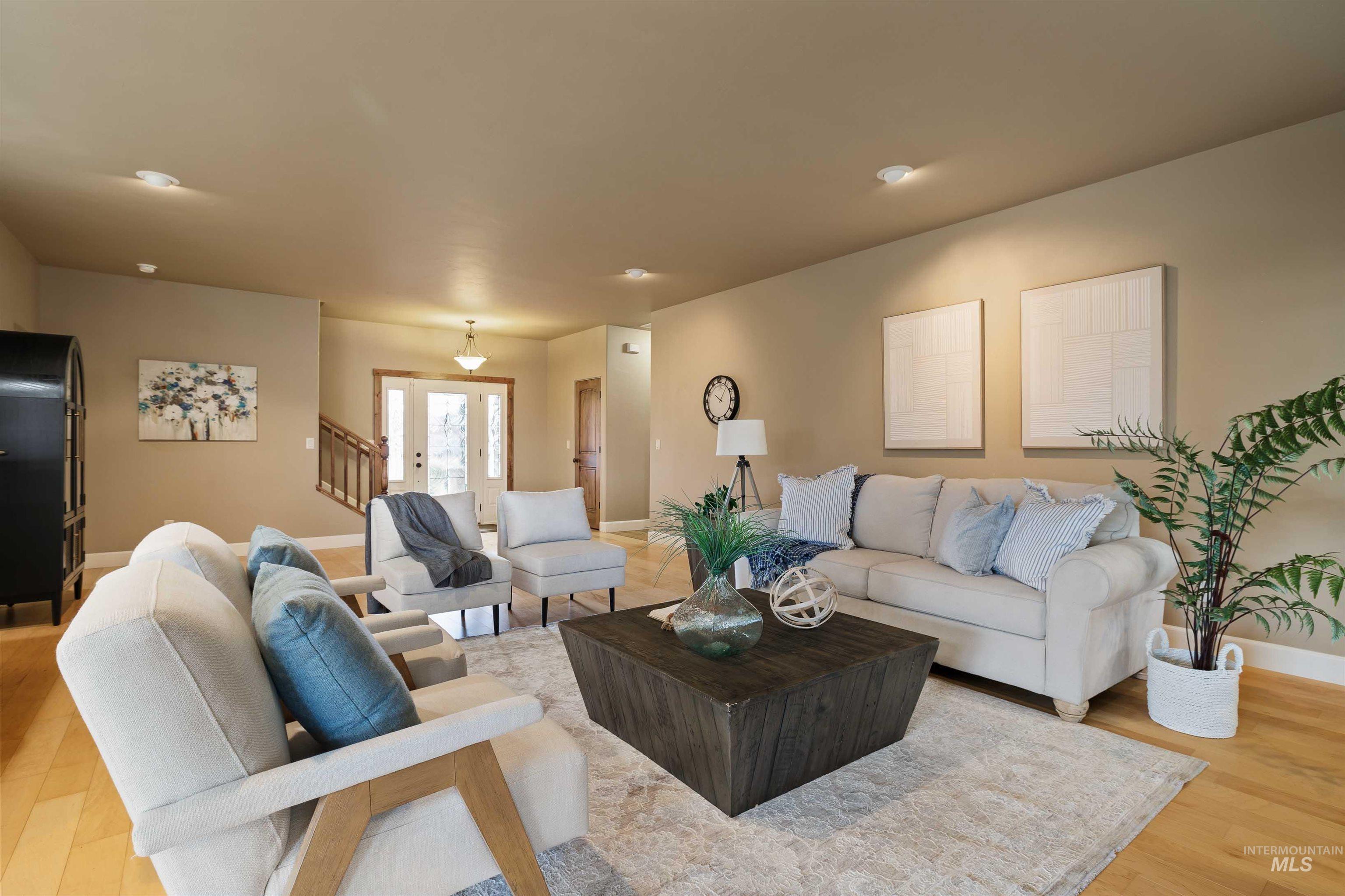 Living room featuring light wood-style flooring and french doors
