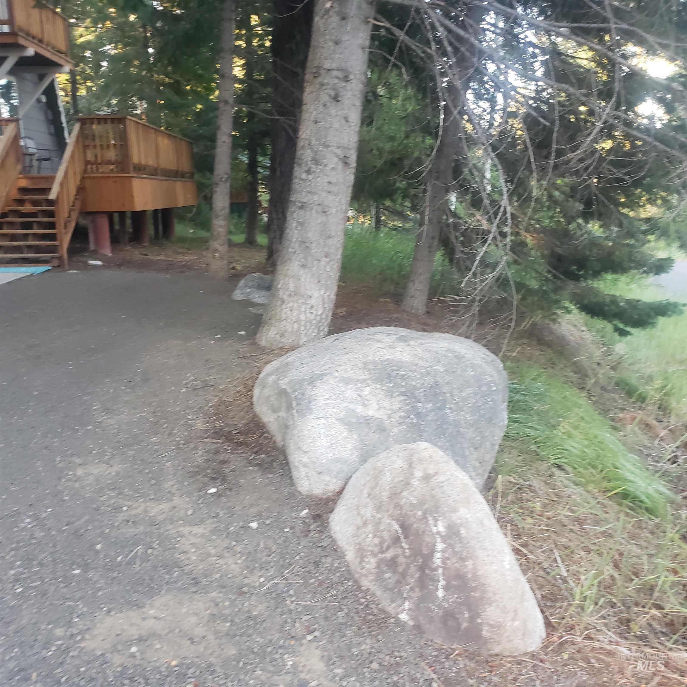 View of yard featuring stairs and a deck