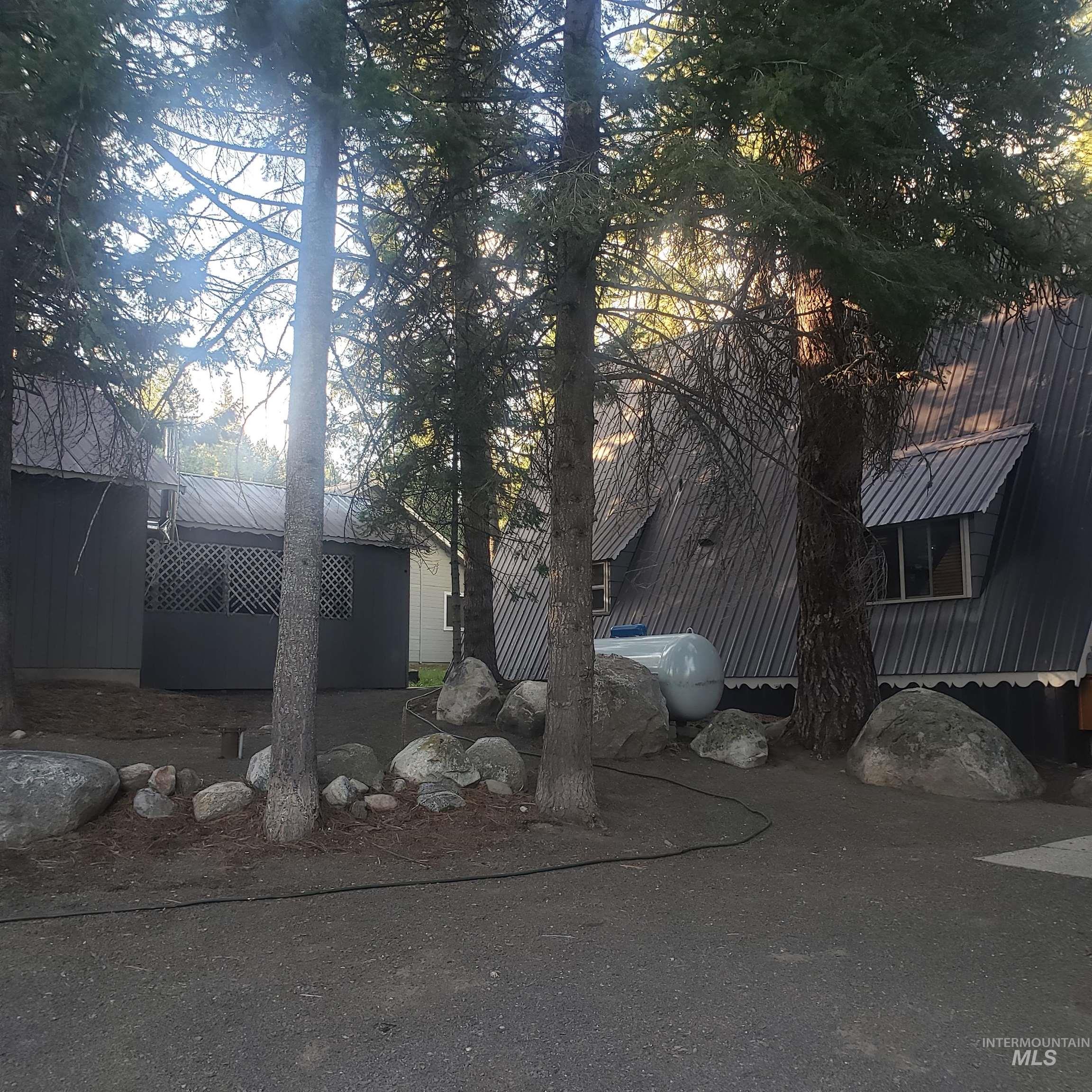 View of property exterior featuring a metal roof