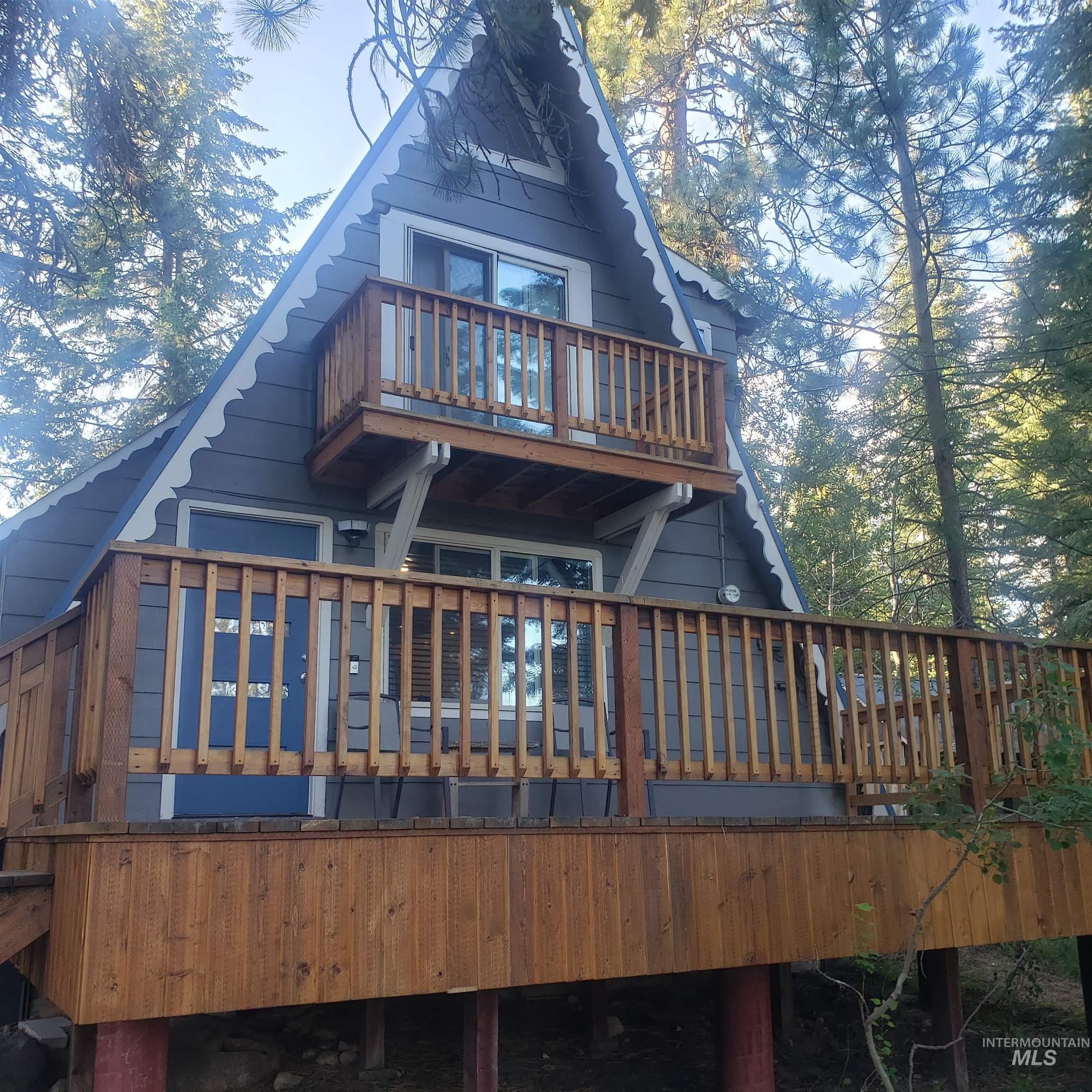 Rear view of property featuring a deck