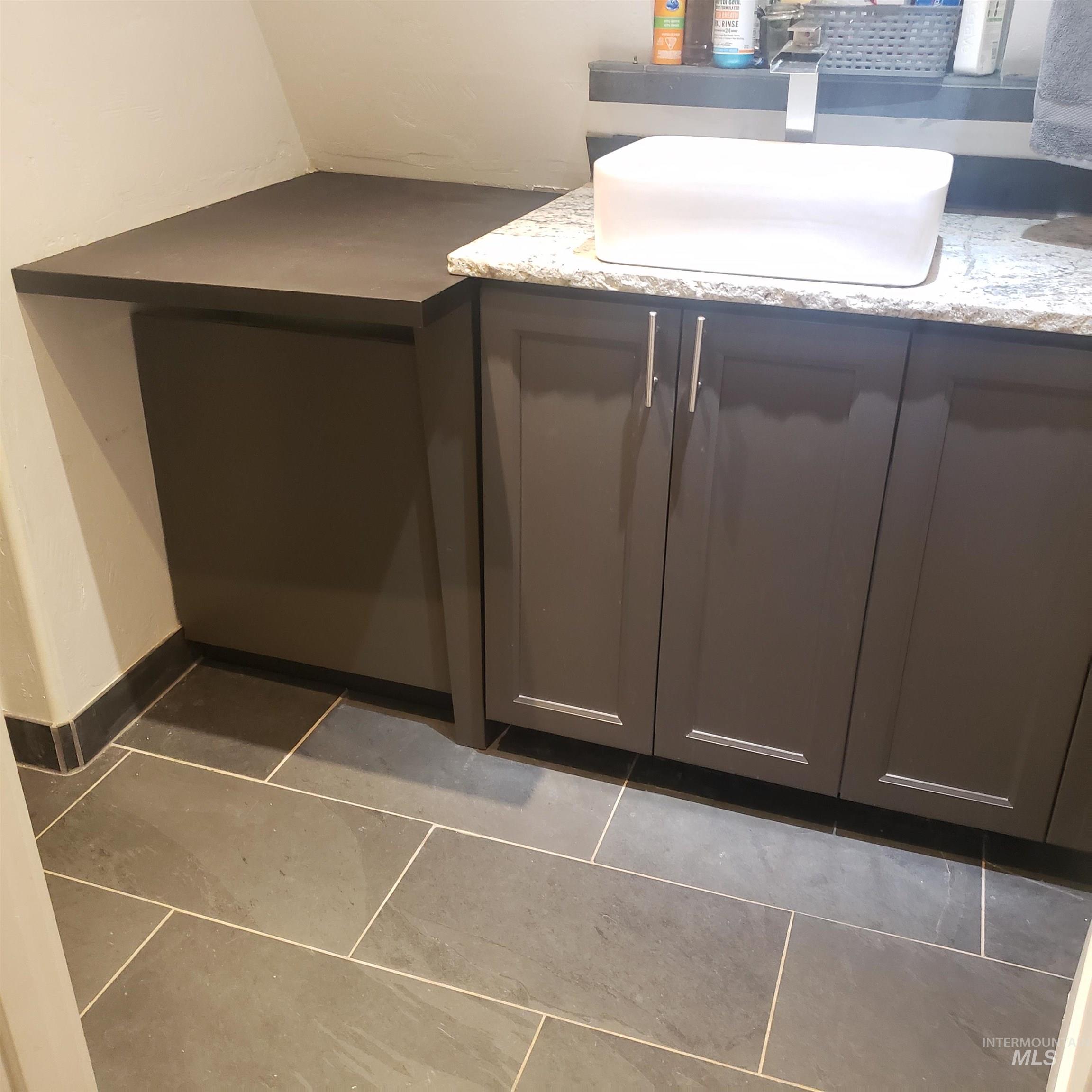 Detailed view of a sink and baseboards