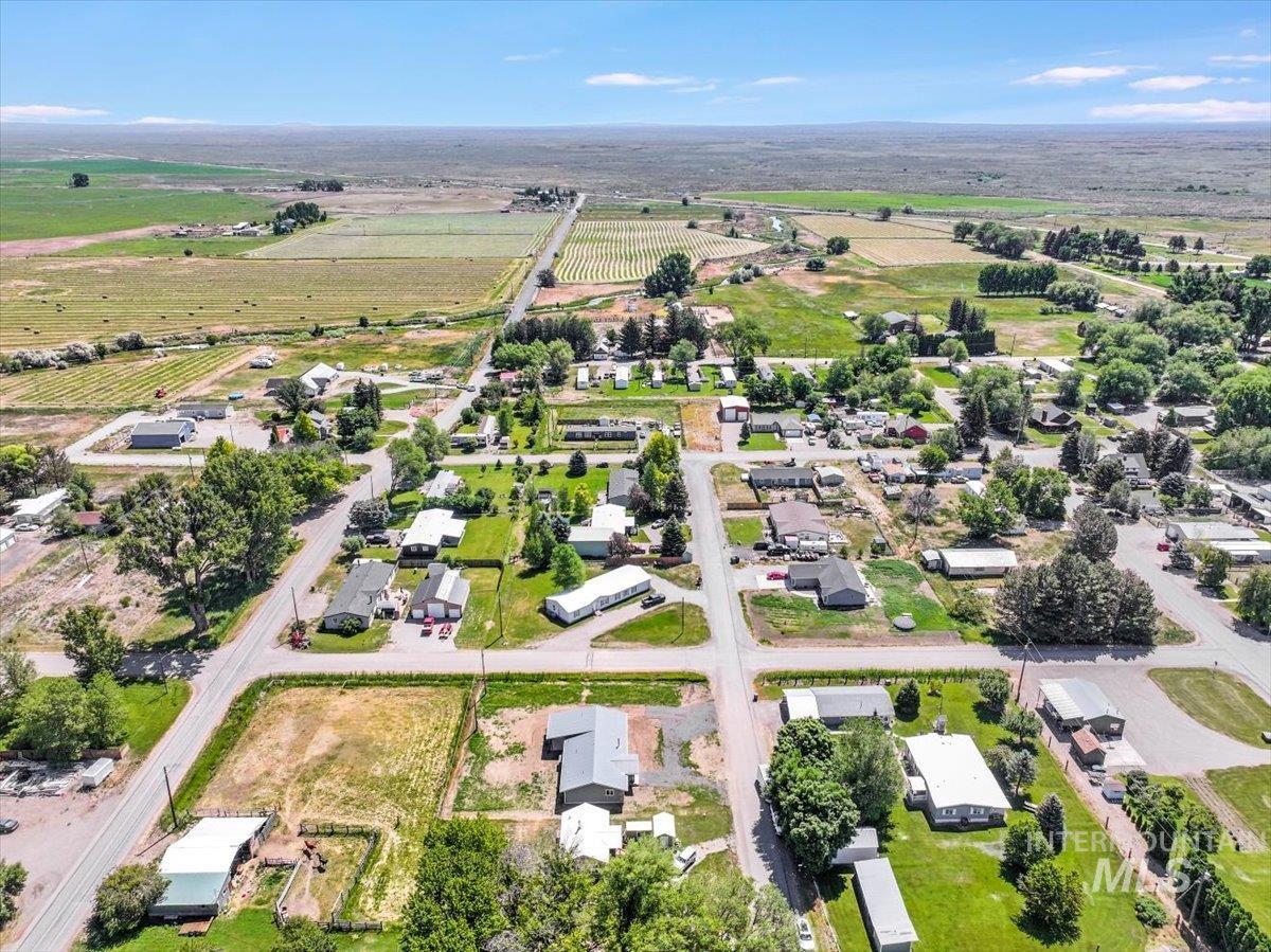 Aerial view of property and surrounding area with rural landscape and extensive farmland