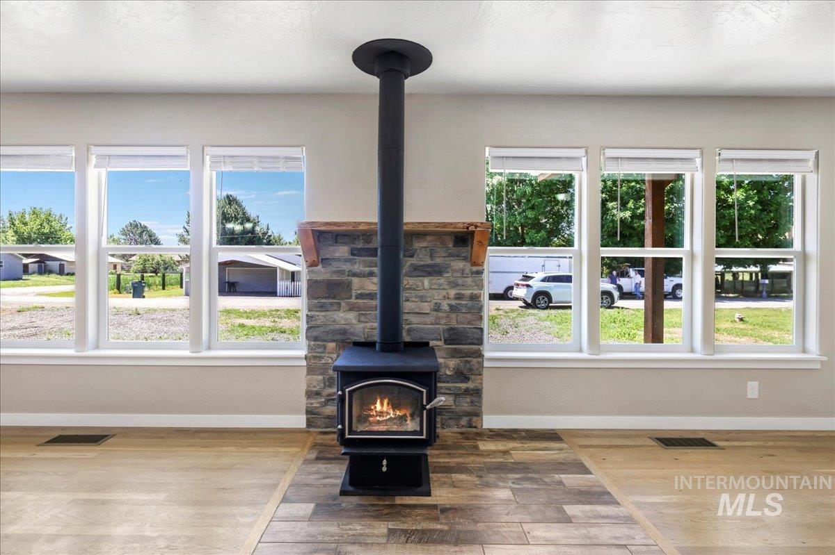 Detailed view of a wood stove and wood finished floors