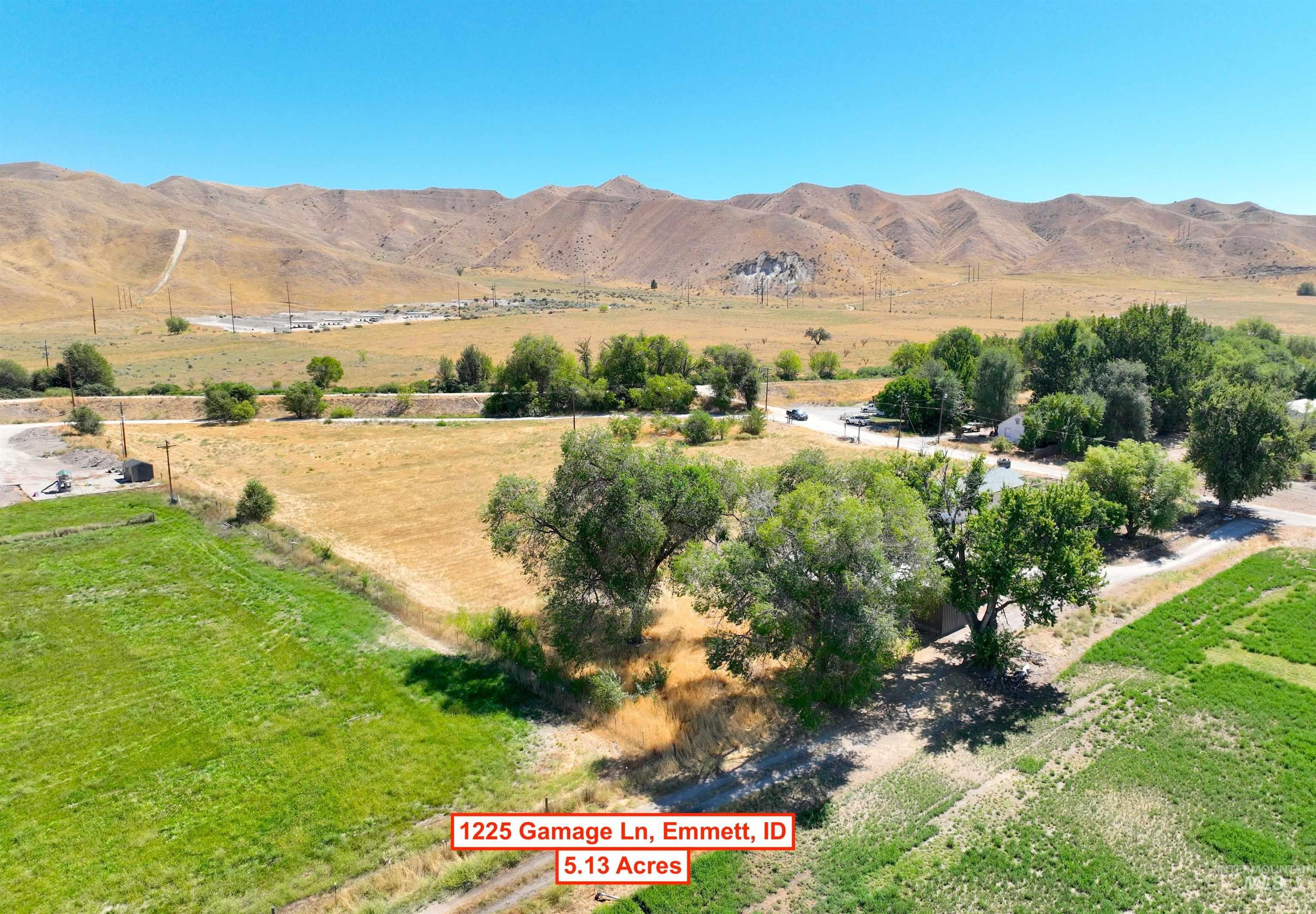View of mountain backdrop with rural landscape