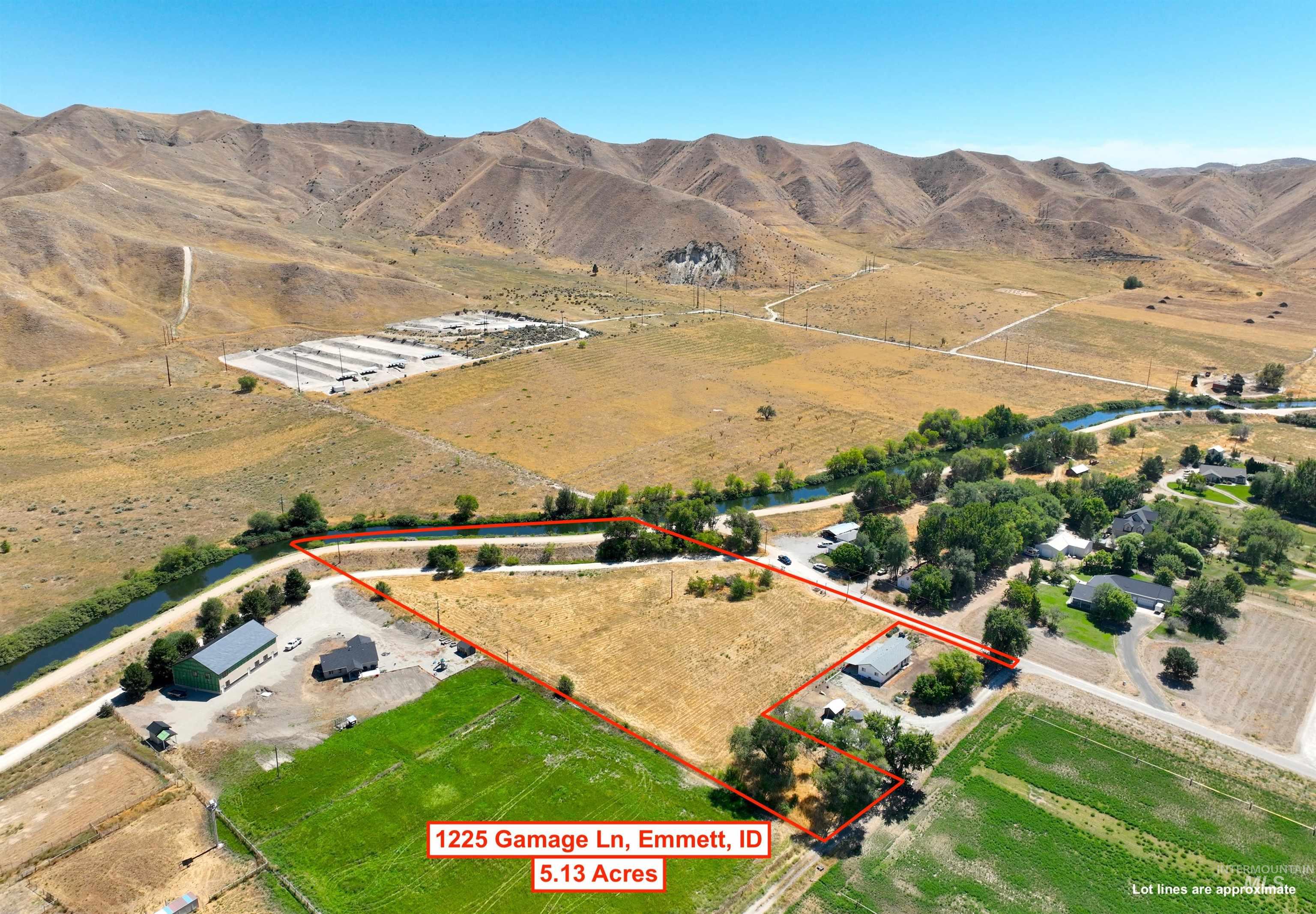 View of rural area with a mountain backdrop and property parcel outlined