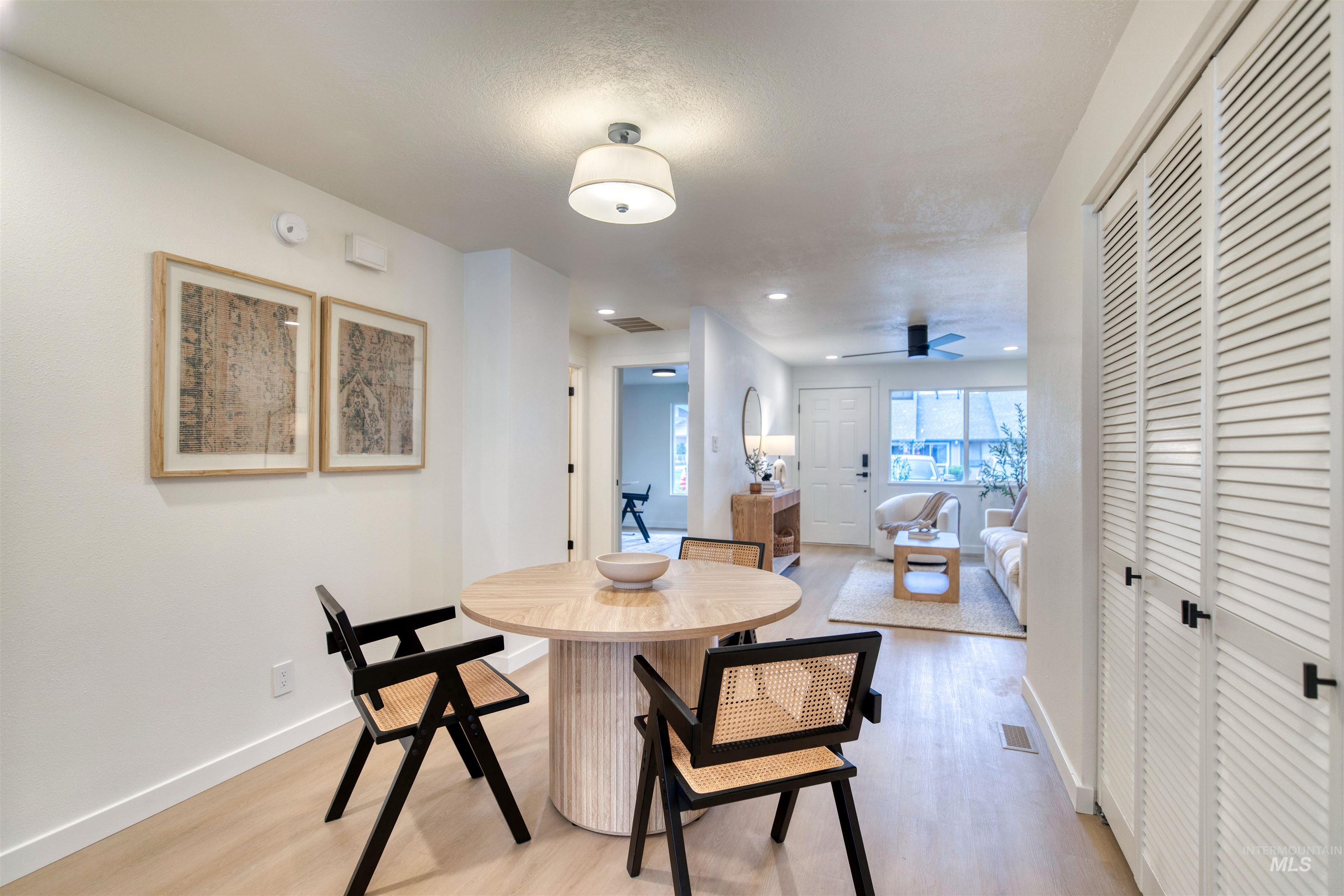 Dining space featuring light wood-style floors, recessed lighting, and ceiling fan