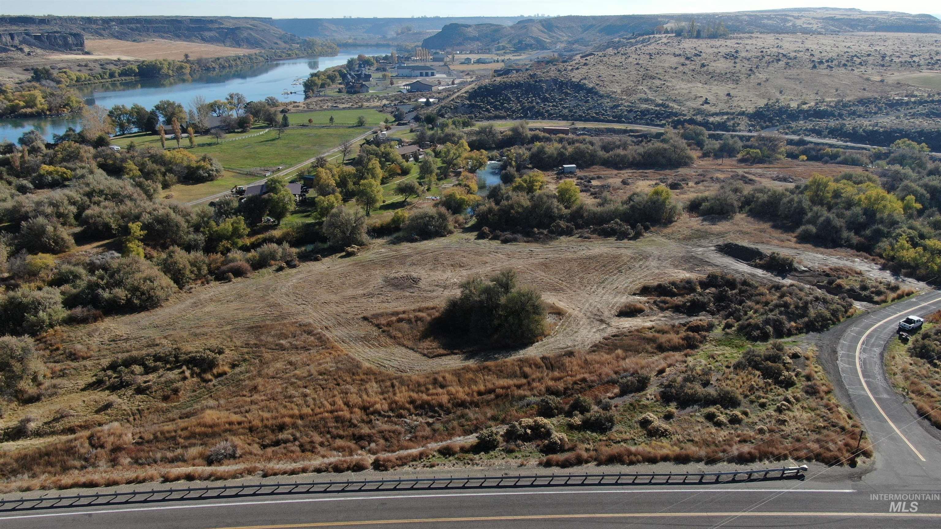Aerial view of property's location featuring a nearby body of water