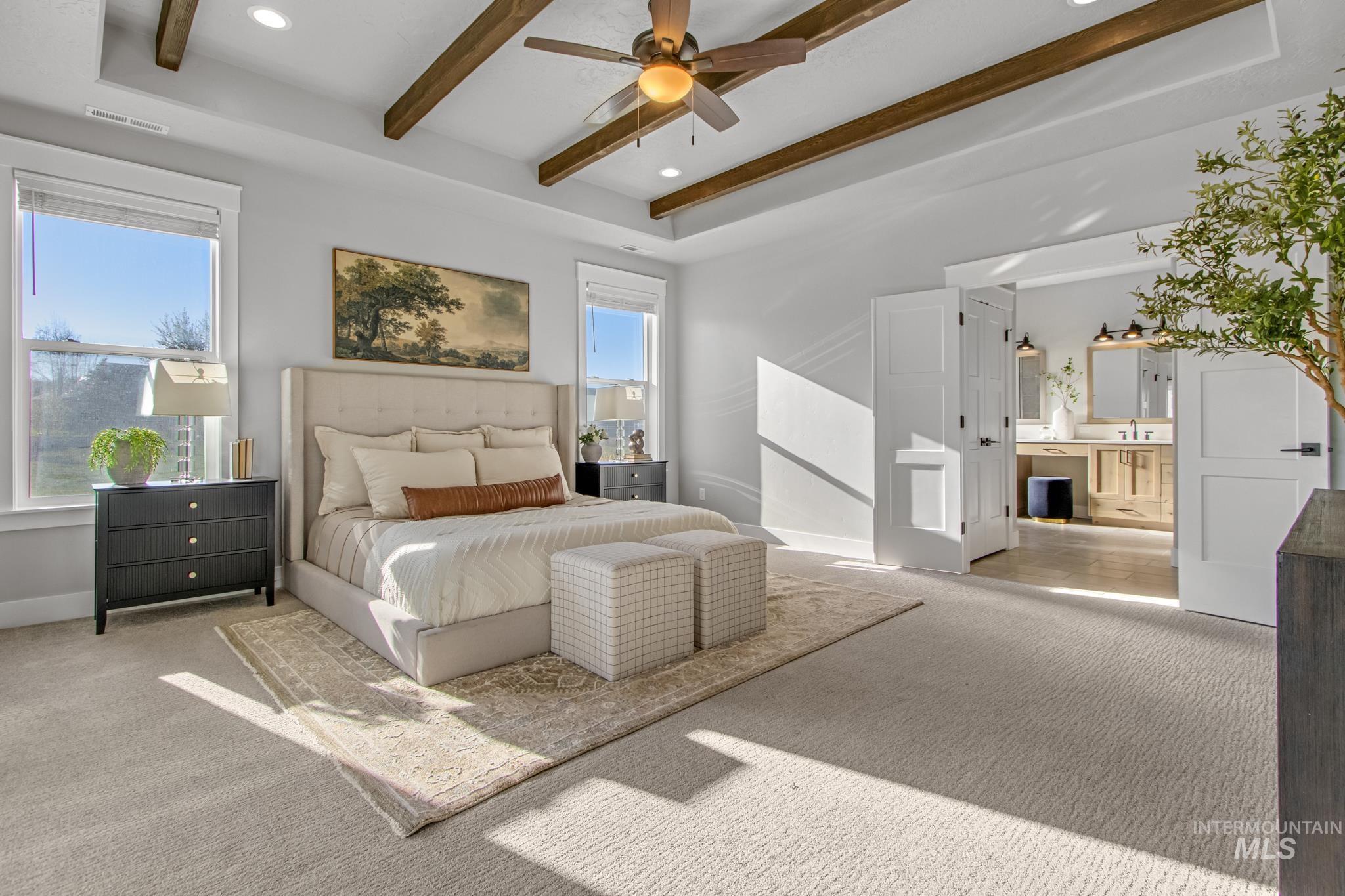 Bedroom featuring carpet flooring, recessed lighting, a ceiling fan, ensuite bath, and beamed ceiling
