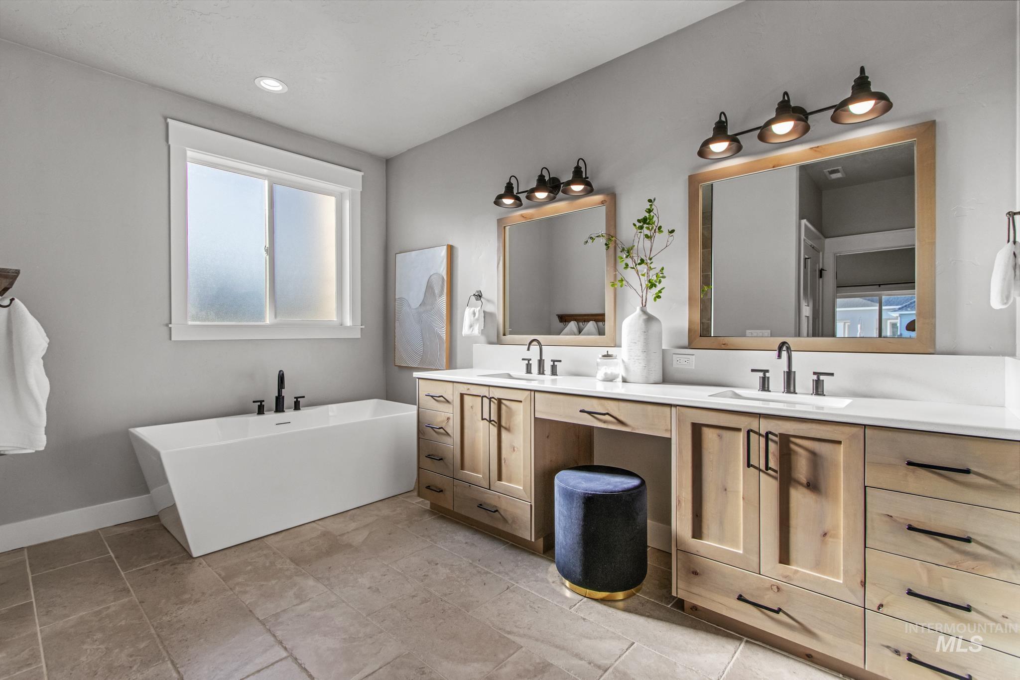 Full bath with a freestanding bath and double vanity