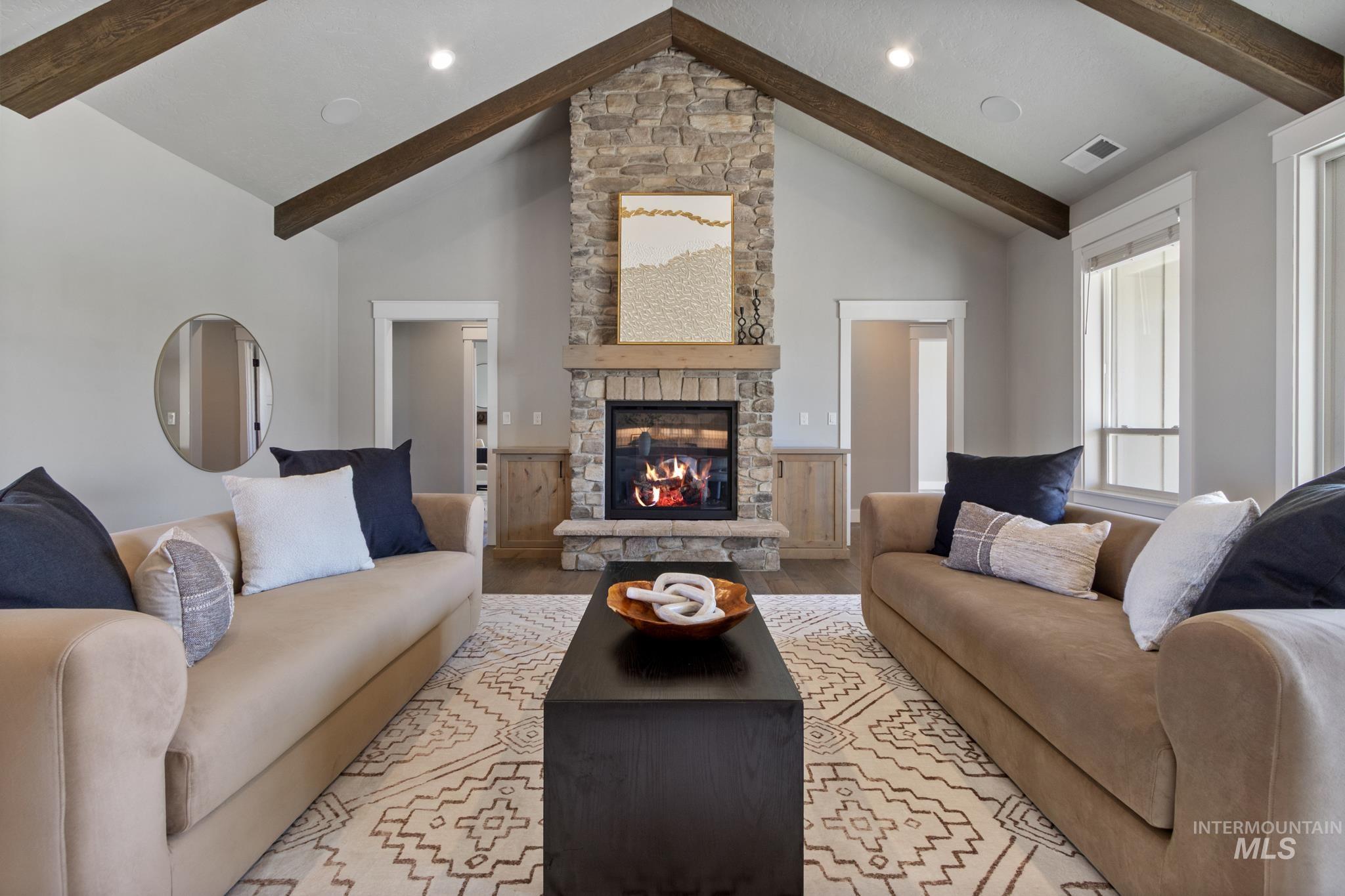 Living room with light wood finished floors and a fireplace